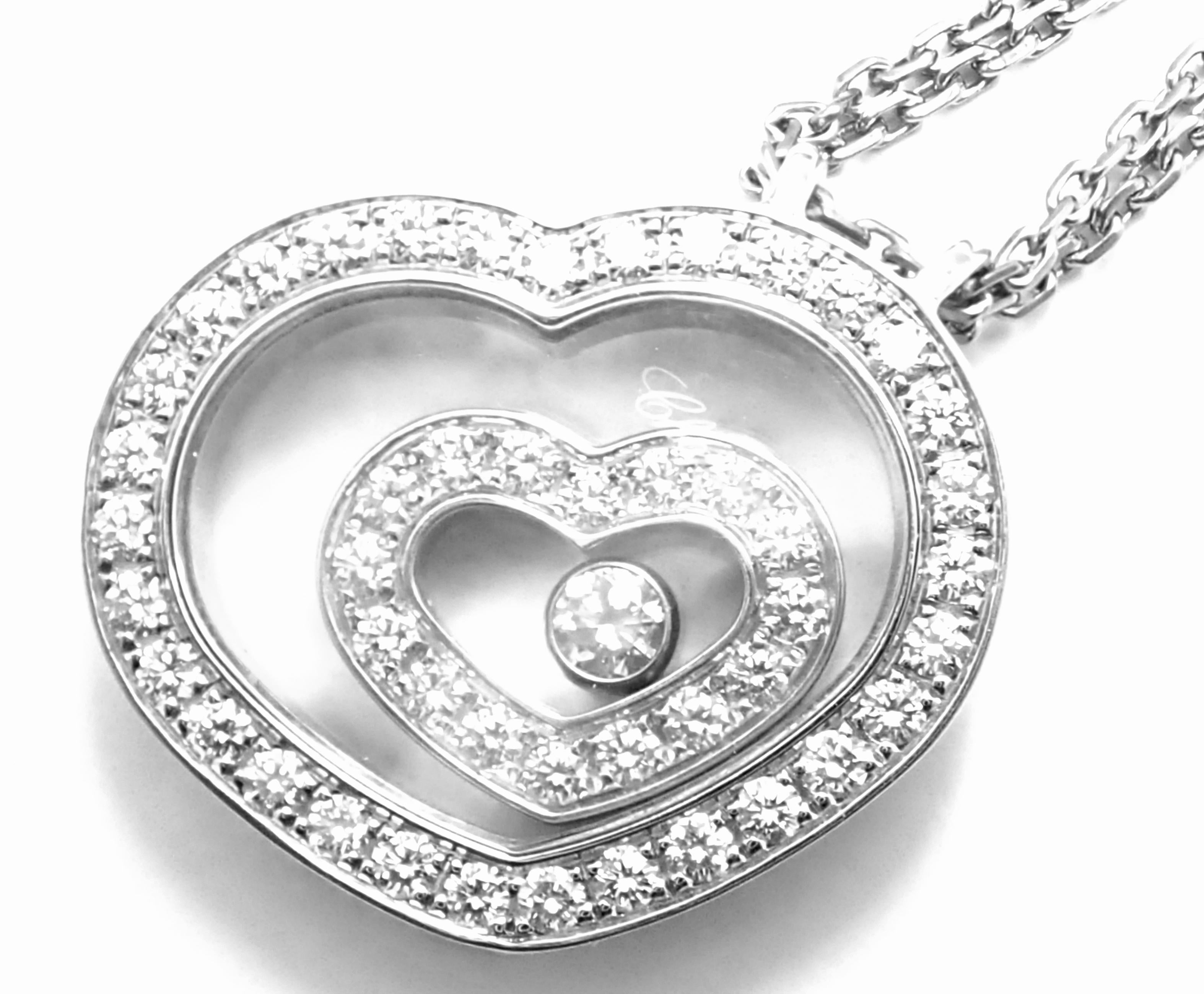 18k White Gold Happy Spirit Diamond Heart Pendant Necklace by Chopard. 
With 48 round brilliant cut diamonds = VVS1 clarity, E color total weight .86ct
This necklace comes with the box and a certificate from Chopard.

This necklace comes with the