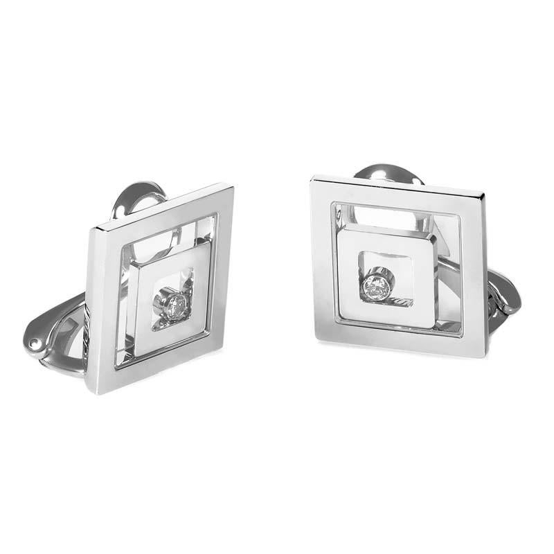 This finely crafted pair of clip-on earrings from Chopard's Happy Spirit Collection are exceptional in design as well as wearability. The earrings are made of 18K white gold and are shaped like squares with smaller squares inside. Lastly, each