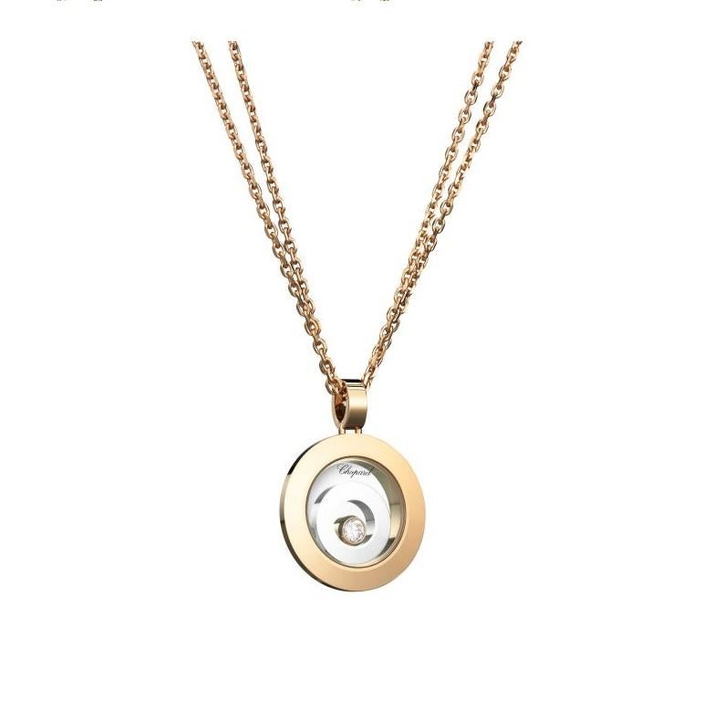 Chopard HAPPY SPIRIT PENDANT with 18k rose gold, 18k white gold and diamond. this pendant in 18k white and rose gold celebrates the play of light in a delicate harmony of solid and void that offers a contemporary setting to the single moving diamond