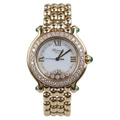 Chopard Happy Sport Uhr aus 18 Karat Gelbgold mit Diamanten und Smaragden