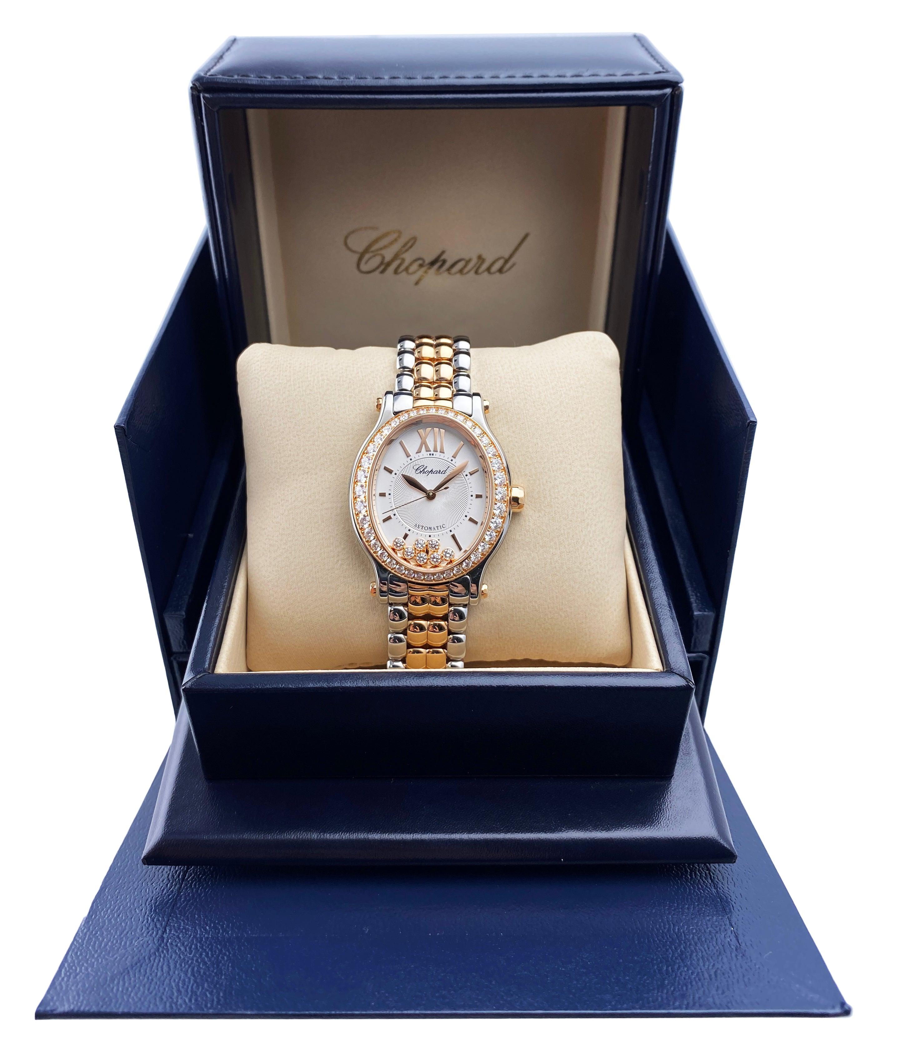 Chopard Happy Sport 278602-6004 Ladies Watch. 29mm stainless steel case. 18K rose gold bezel with factory diamond. Silver dial with rose gold hands and Roman numeral & index hour markers. Original factory diamonds set of 7 floating. Minute markers