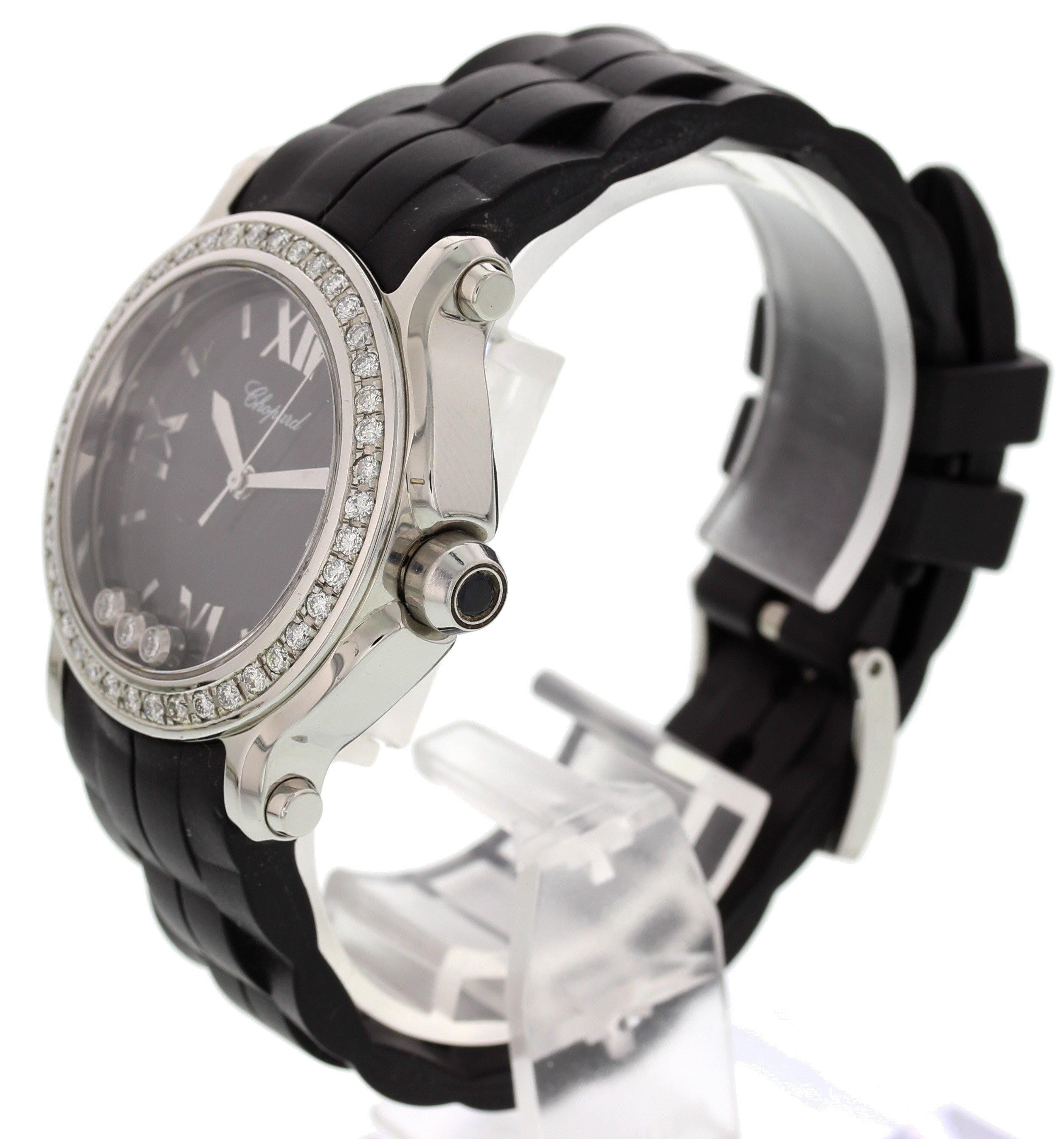 Chopard Happy Sport Floating Diamonds 8475. 36 mm stainless steel case. Stainless steel bezel with diamonds. Black dial with date display and steel hands and Roman numeral markers. Round diamonds floating within dial. Adjustable black rubber strap