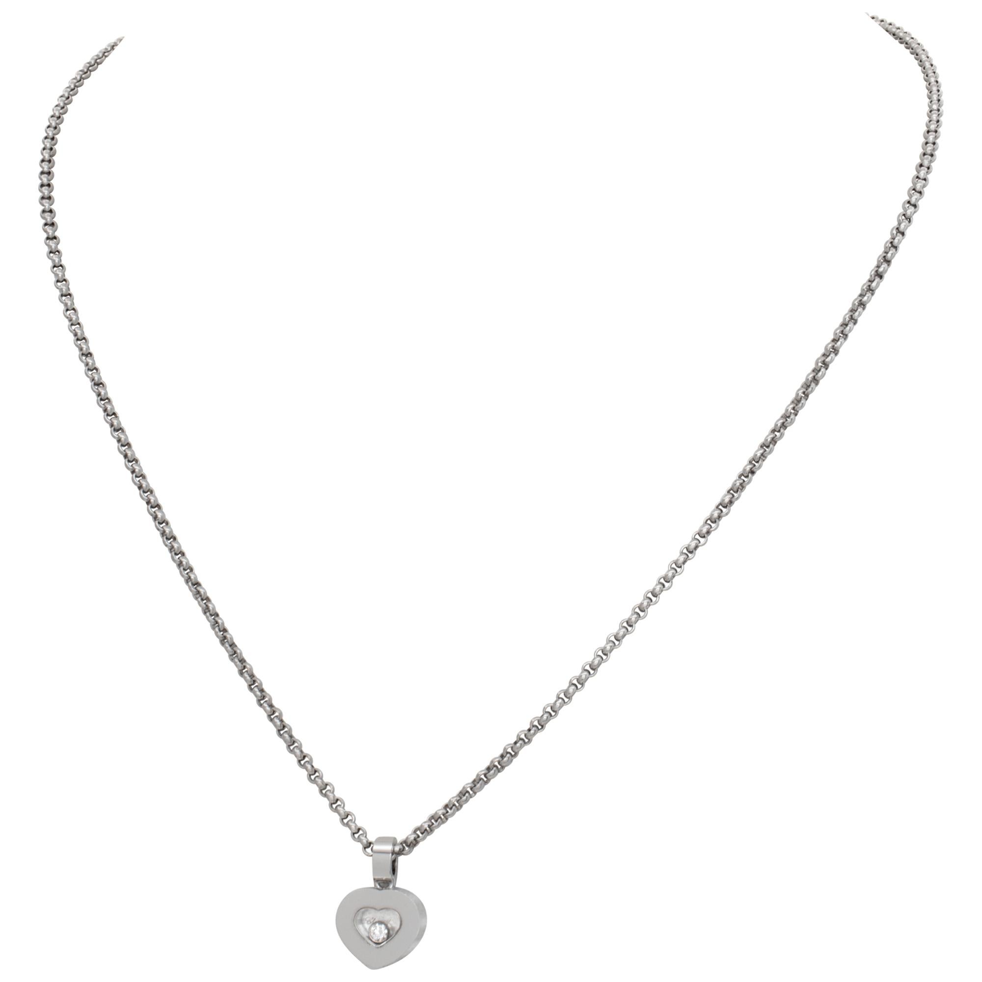 Chopard Happy Sport Heart pendant and chain in 18k white gold with single floating diamond. Total carat weight 0.05 cts. Chain length 16 inches.