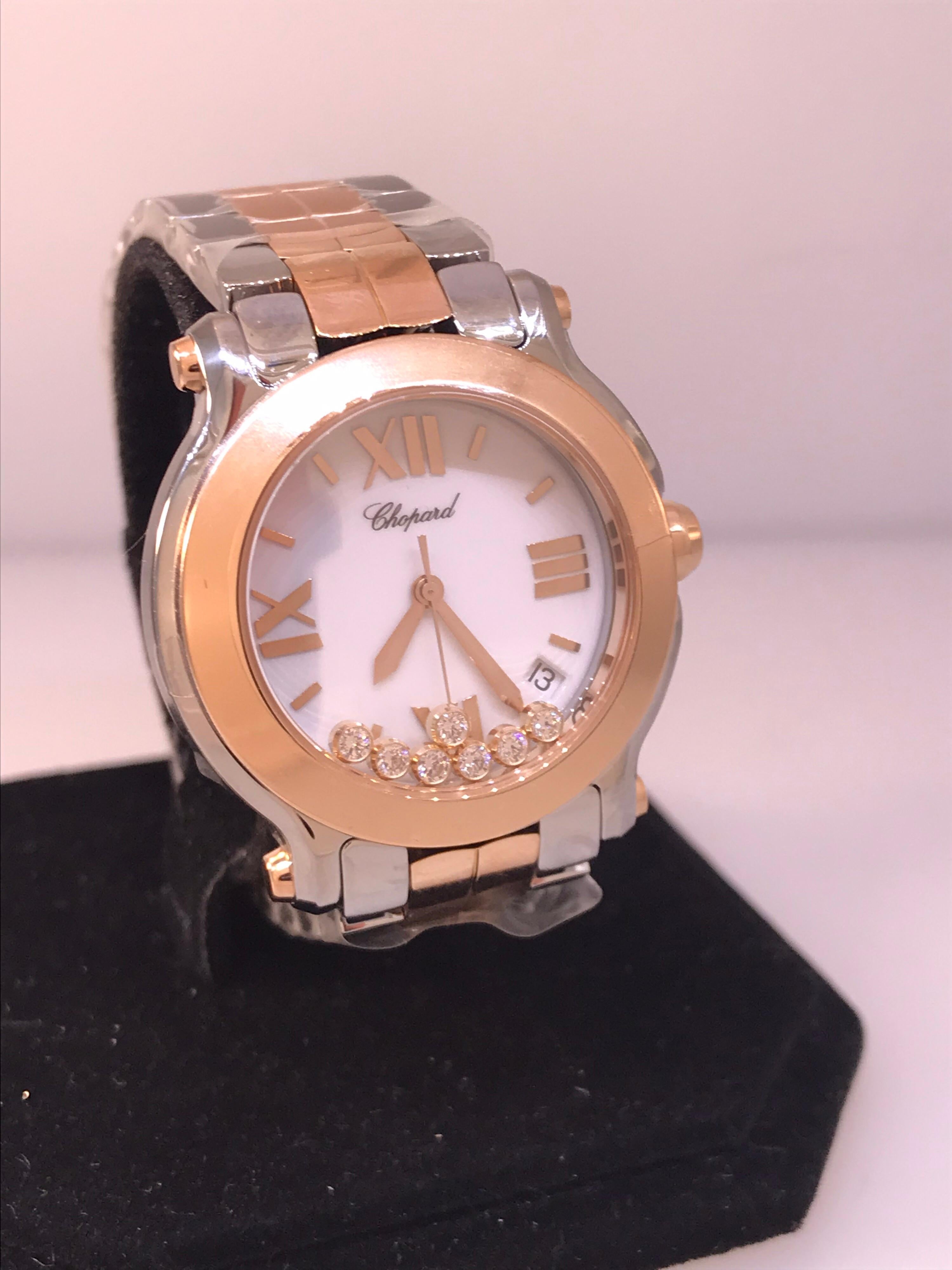 Chopard Happy Sport Ladies Watch

Model Number: 27/8488-9001

100% Authentic

Brand New 

Comes with original Chopard box, certificate of authenticity and warranty, and instruction manual

Stainless Steel and 18 Karat Rose Gold Case &