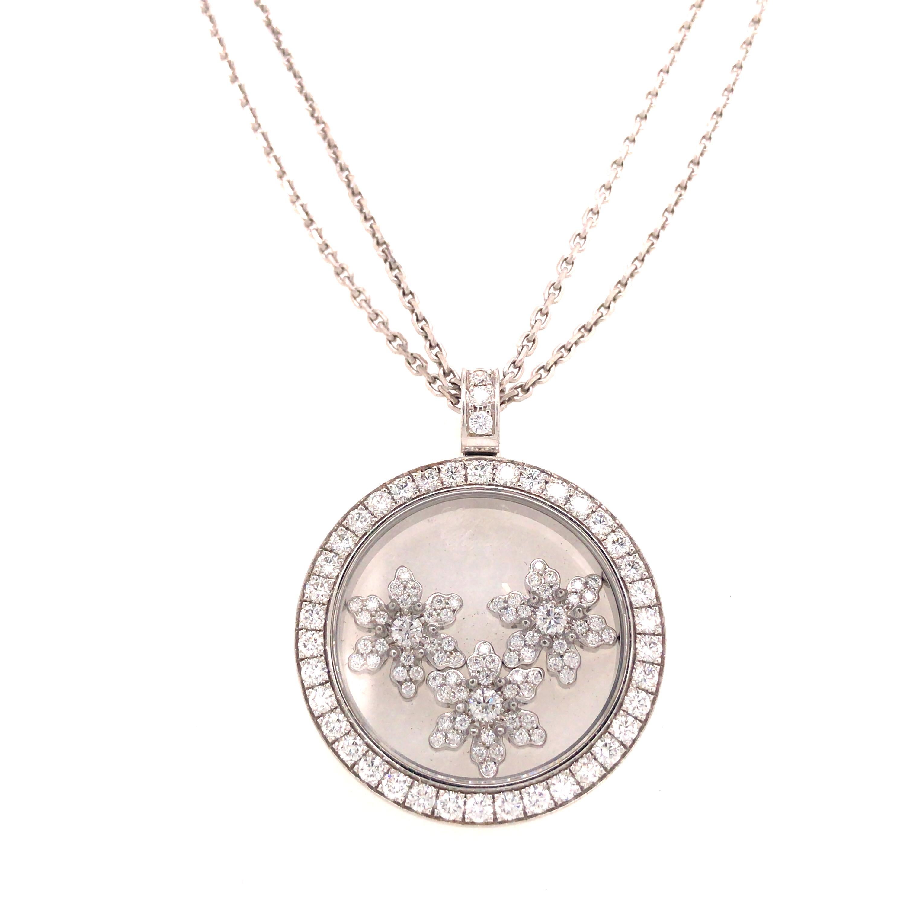 Chopard Happy Sport Snowflakes Pendant Double Strand Necklace in 18K White Gold.  Round Brilliant Cut Diamonds weighing 0.96 carat total weight E-F in color and VS in clarity are expertly set.  The Pendant measures 1 inch in diameter and hangs on a