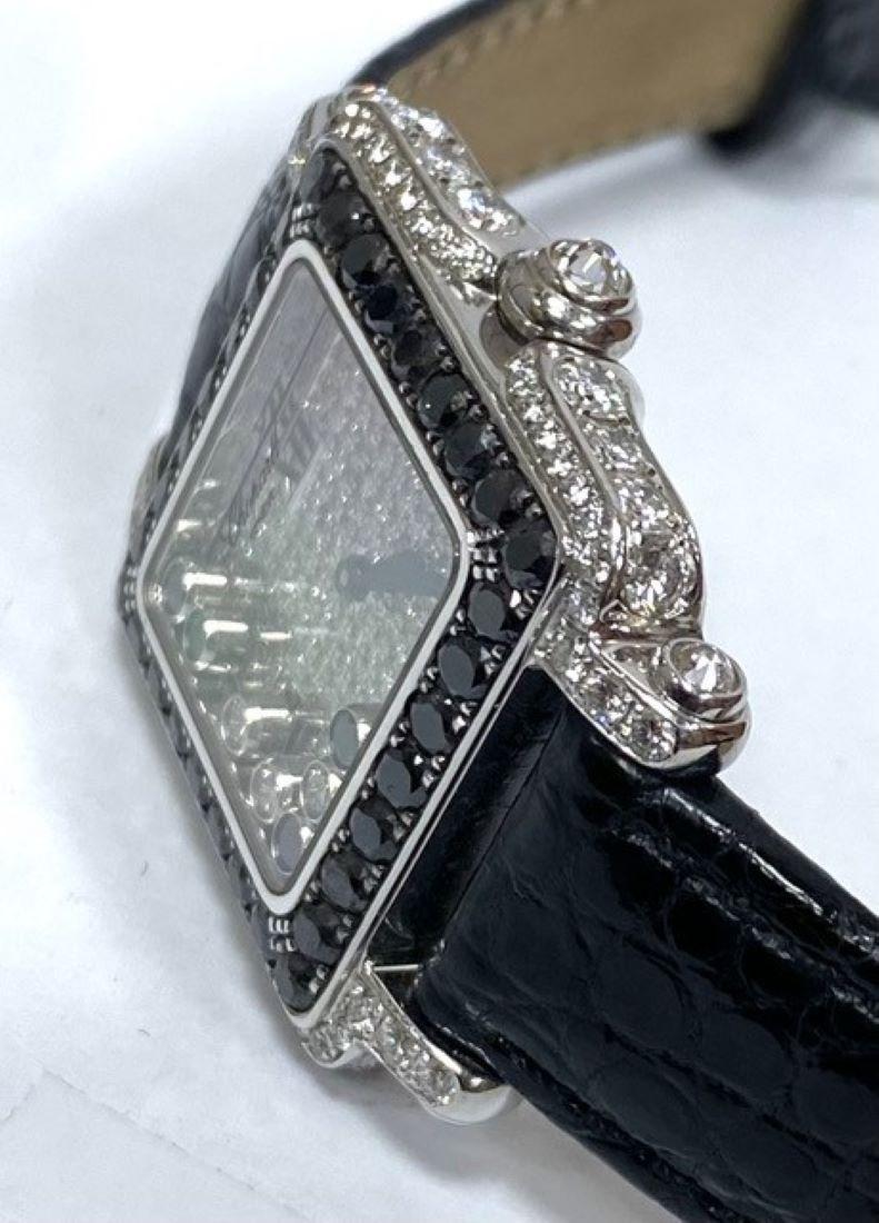 Chopard Happy Sport White Gold Diamond Watch
Diamond Dial
27mm Case, Set with Black And White Diamonds
Quartz Movement 
Black Alligator Strap
Retail $45,000.00
