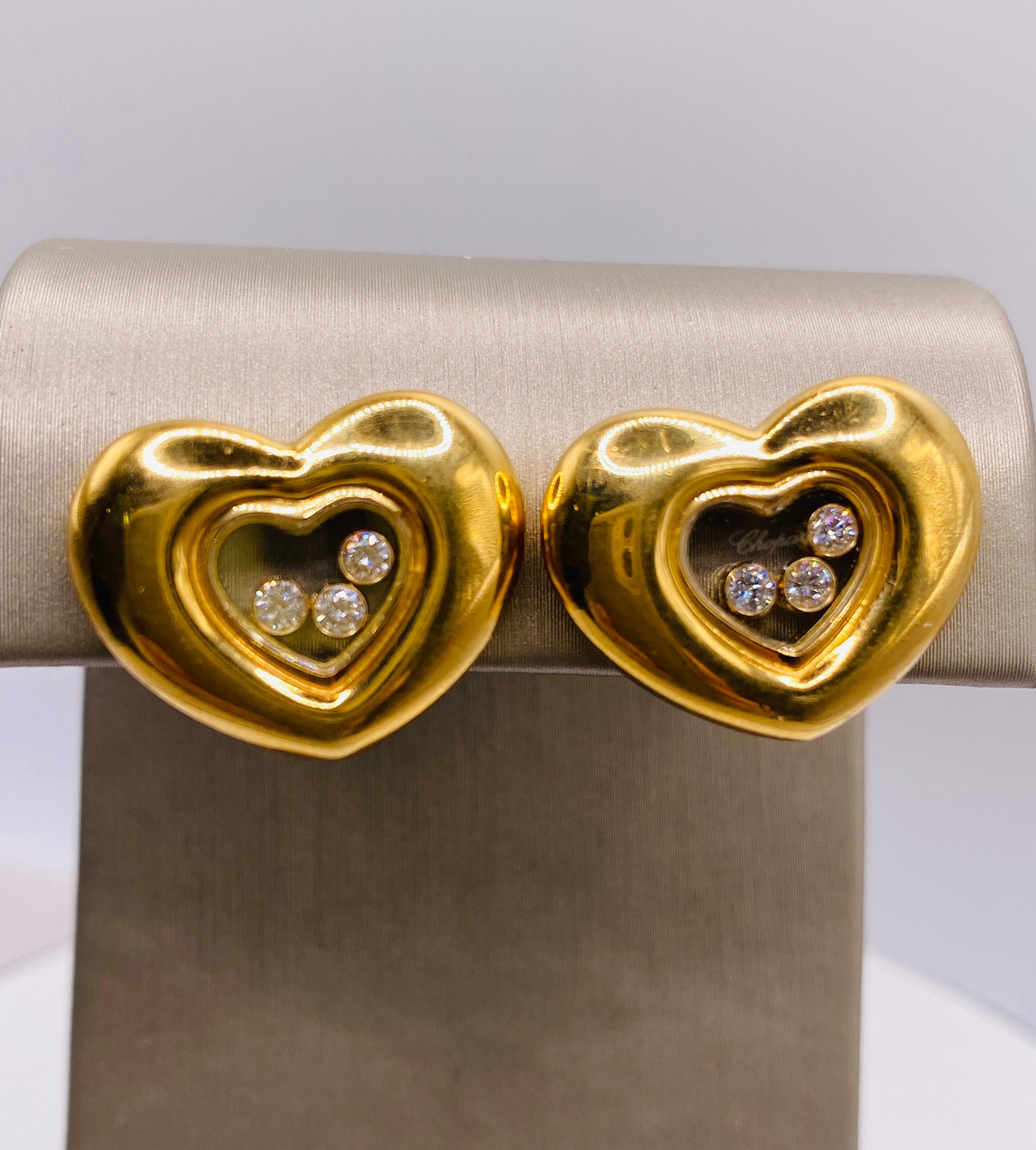  Chopard 18K yellow gold Happy Diamond Heart Clip Earrings with 6= approx. 0.25ctw round brilliant diamonds. Etched Chopard Geneve. Stamped Chopard, Swiss, 750, 84/1742-20 and 9651747. Weight 18.7gm. Each heart measures approximately 20 x 16mm.