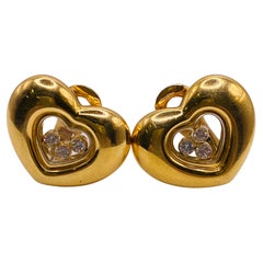 Chopard Clips d'oreilles en forme de cœur avec diamants dansants