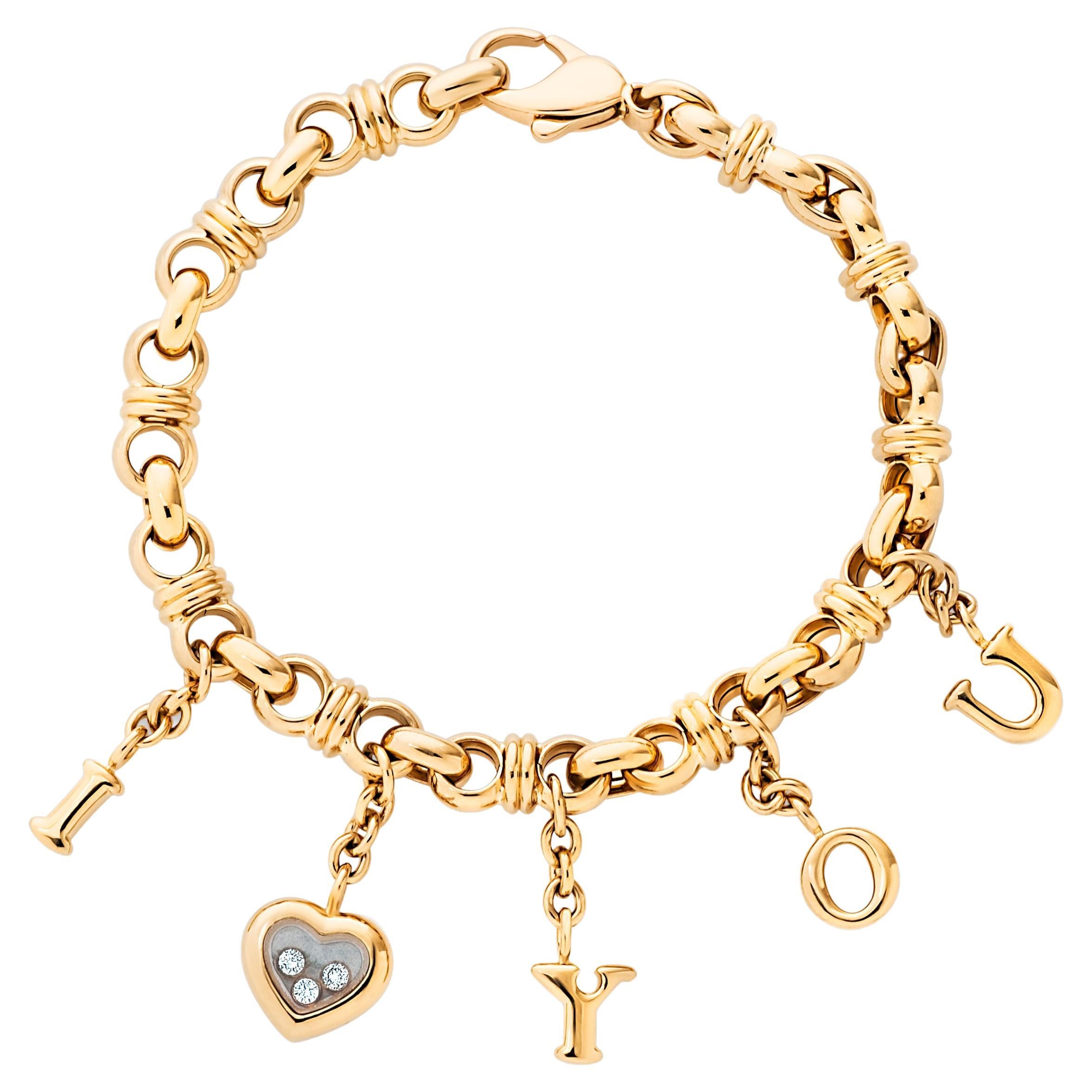 Chopard, bracelet à breloques « I Love You » Happy Diamonds en or jaune 18 carats en vente