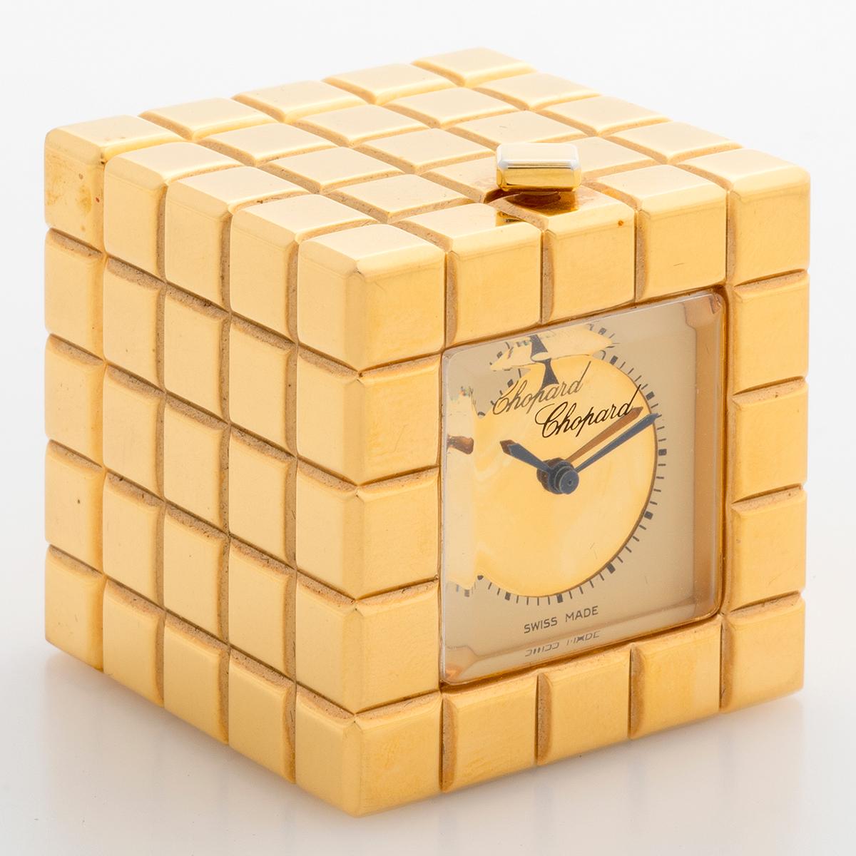 Our vintage and very attractive Chopard Ice Cube Alarm clock , reference 51/8898/00 features a gold tone case of 35mm x 35mm . Complete with inner and outer box, this Ice Cube is presented in outstanding condition with only very light signs of use