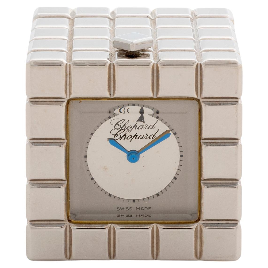 Our rare and vintage Chopard Ice Cube Alarm clock , reference 51/8898/00 features a silver tone case of 35mm x 35mm . Complete with inner and outer box, this Ice Cube is presented in outstanding condition with only very light signs of use from new.