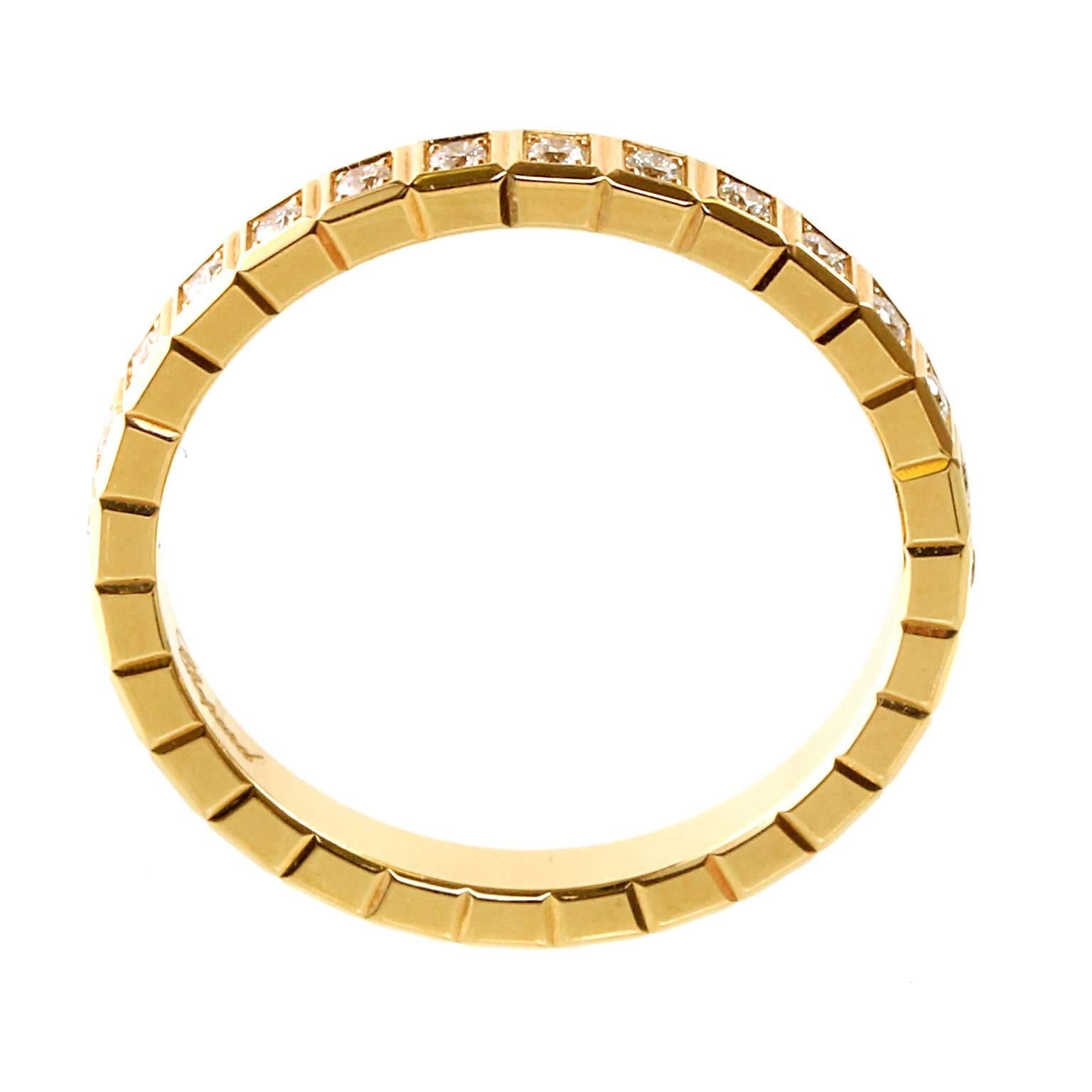 A beautiful 18kt yellow gold Chopard Eternity diamond ring featuring an Ice Cube designed adorned with 28 Round Brilliant Cut Diamonds (,31ct) into a brilliant, glittering loop around the entire Band.

Size: 7 1/4 US
Dimensions: The band measures