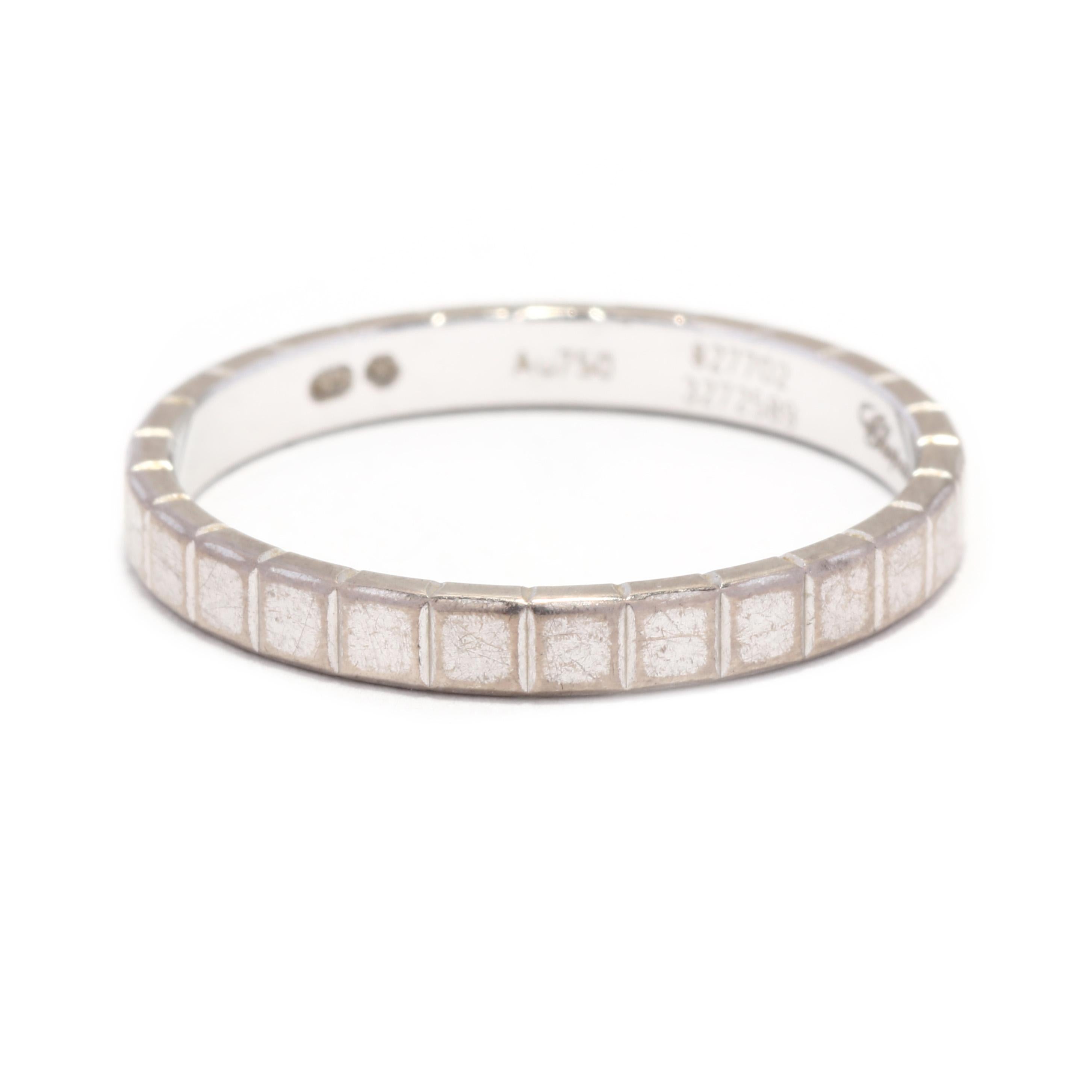 This Chopard Ice Cube eternity band ring is a beautiful piece of jewelry that will add a touch of elegance to any outfit. Made with 18K white gold, this ring is a size 7 and is perfect for everyday wear. The ring features a simple yet stunning ice