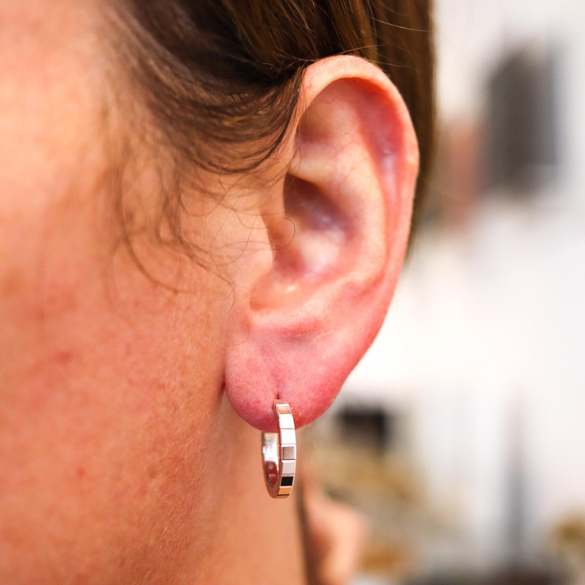 Hoops earrings designed by Chopard.

Beautiful pair of hoops earrings, created in Switzerland by the jewelry house of Chopard. This ultra modernist pair are from the iconic collection Ice-Cube and has been crafted with geometric patterns in solid