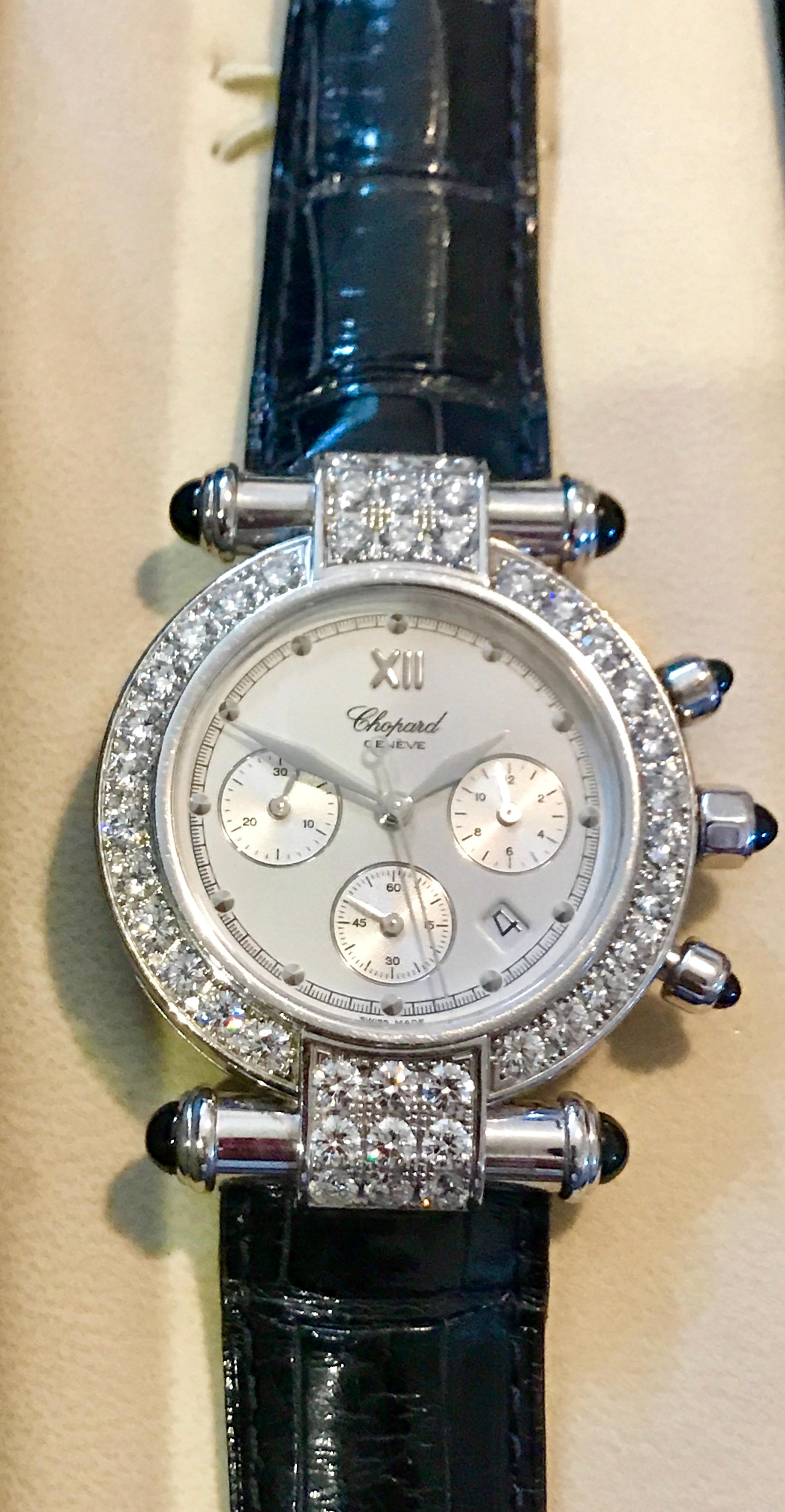 Chopard  2004
Imperiale Chronograph with Diamond Bezel
18 Karat White Gold on Black Leather Strap 
Case:	18 Karat White Gold
Case Size:	37mm
Movement:	Quartz
Bracelet:	Black Leather Strap
Model # 136940
* Pre-Owned (Used) with Box no Papers
This