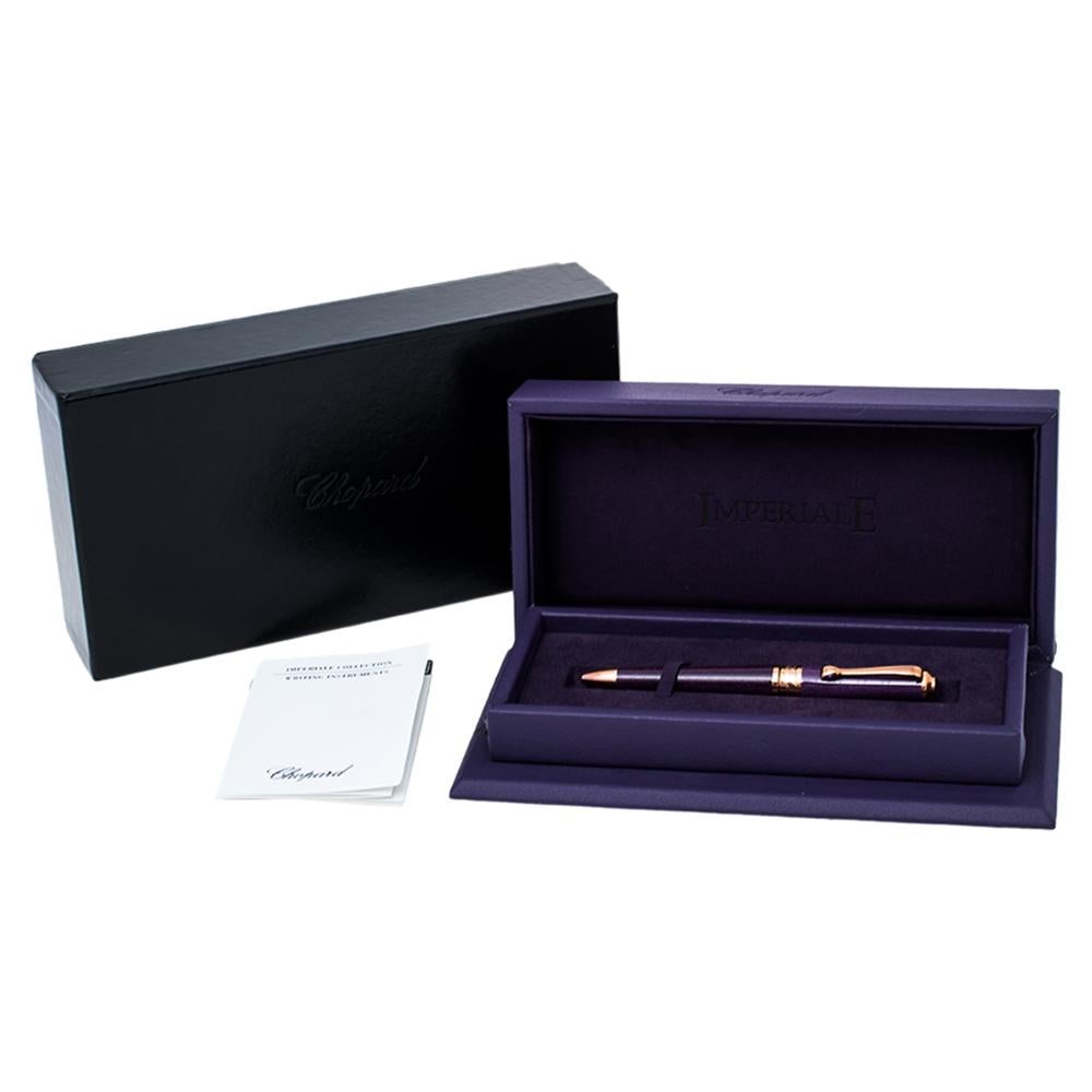 This Chopard Imperiale ballpoint pen is made from purple resin as well as gold-plated metal and decorated with cabochon. Grand in design and highly functional, this ballpoint pen is worth the buy.

Includes: Original Case, Original Box