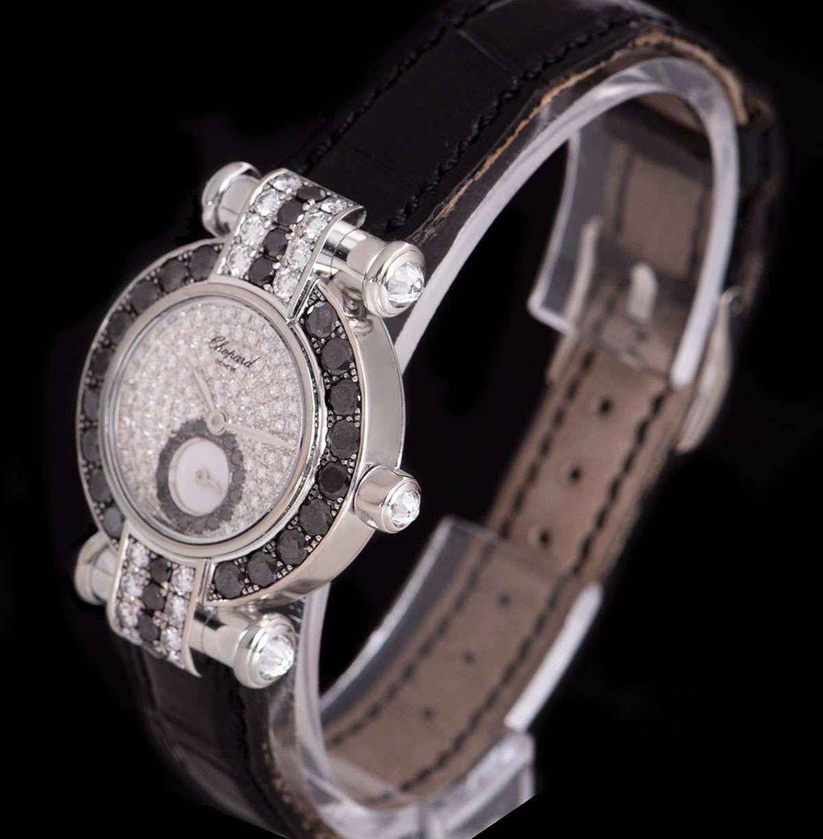 An 18k White Gold Imperiale Ladies Wristwatch, pave diamond dial set with approximately 114 round brilliant cut diamonds (0.99ct), small seconds sub-dial at 6 0'clock set with approximately 15 black round brilliant cut diamonds, a fixed 18k white