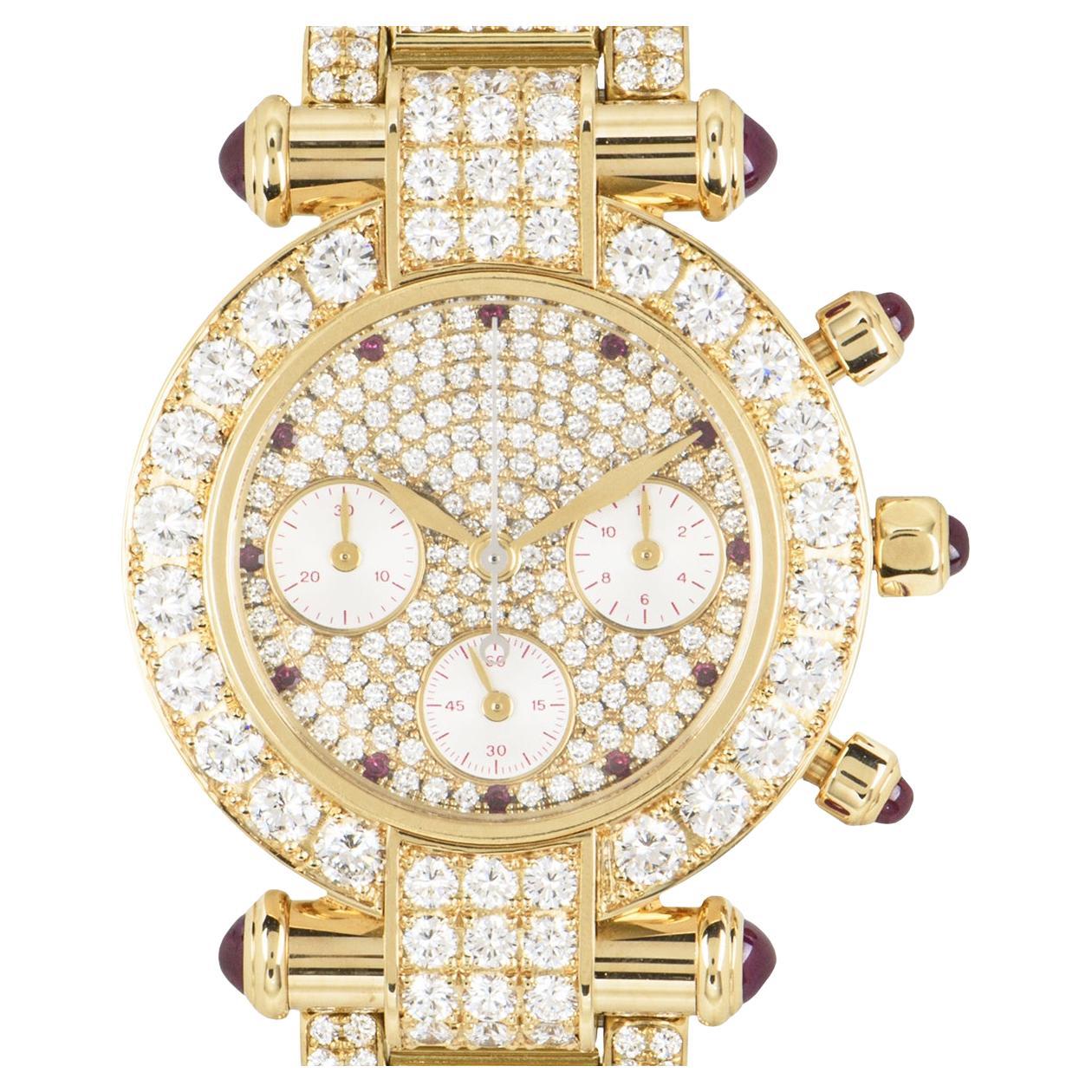 A striking 32mm ladies Imperiale wristwatch, crafted in yellow gold by Chopard. Features a pave diamond dial with 11 round cut ruby hour markers and 3 sub dials. Complementing the dial is a fixed yellow gold bezel and lugs which are set with round