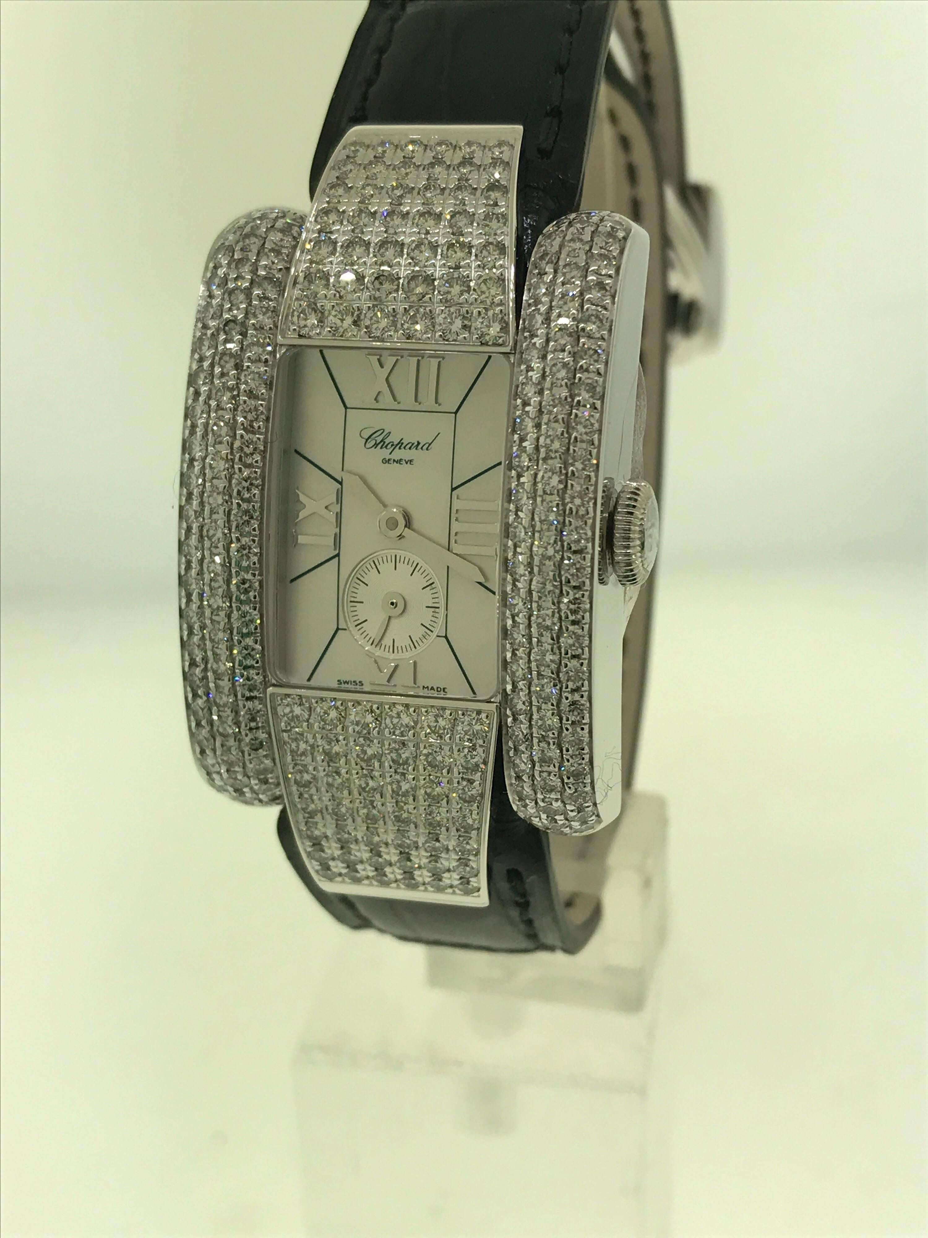 Chopard La Strada Lady's Watch

Model Number: 41/6847-1001

100% Authentic

Brand New

Comes with original Chopard box, certificate of authenticity and warranty, and instruction manual

18 Karat White Gold Case and Buckle  (49gr)

Sapphire
