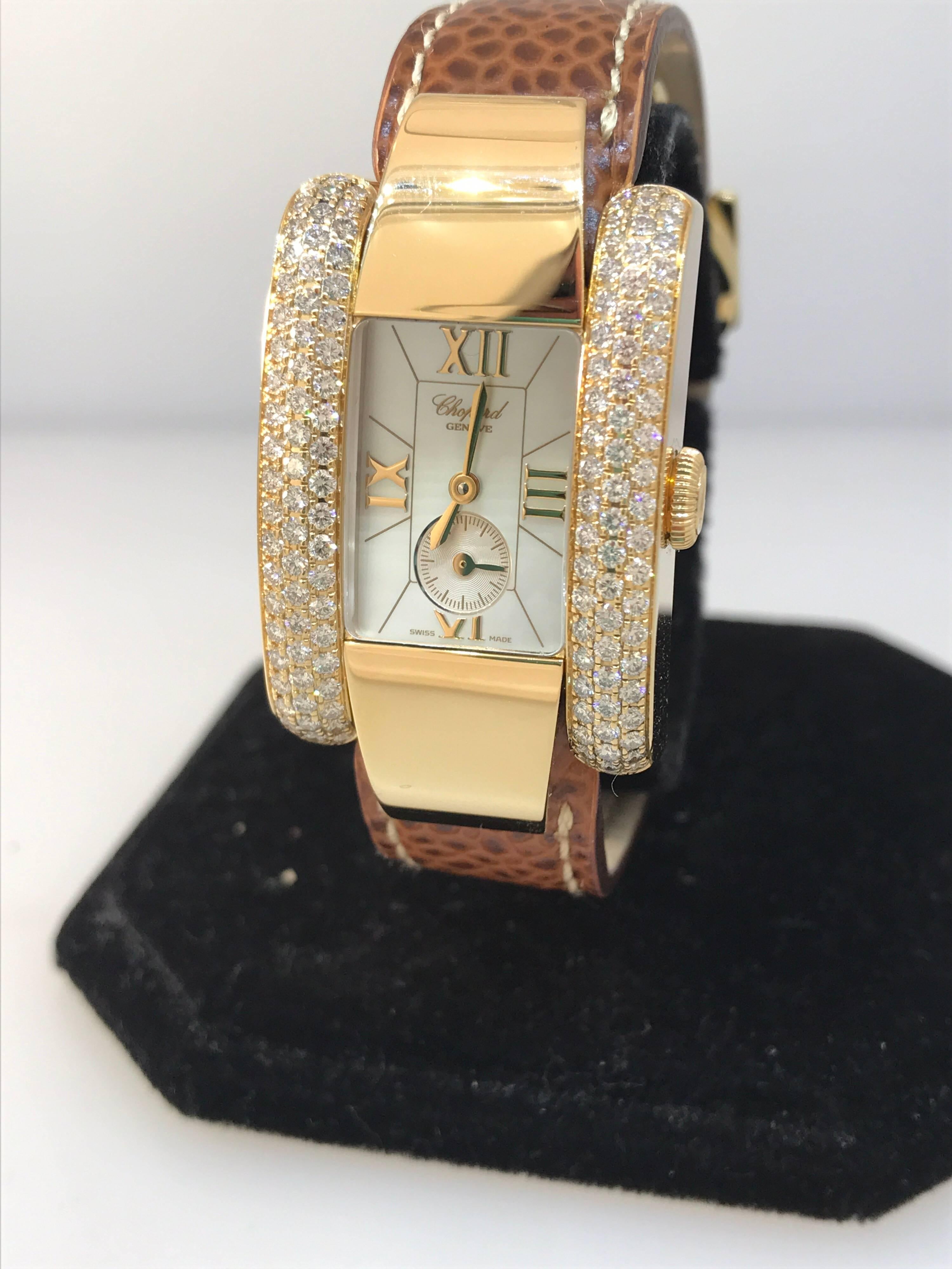Chopard La Strada Lady's Watch

Model Number: 41/6823-0001

100% Authentic

Brand New

Comes with original Chopard box, certificate of authenticity and warranty, and instruction manual

18 Karat Yellow Gold Case and Buckle  (63.20gr)

Sapphire