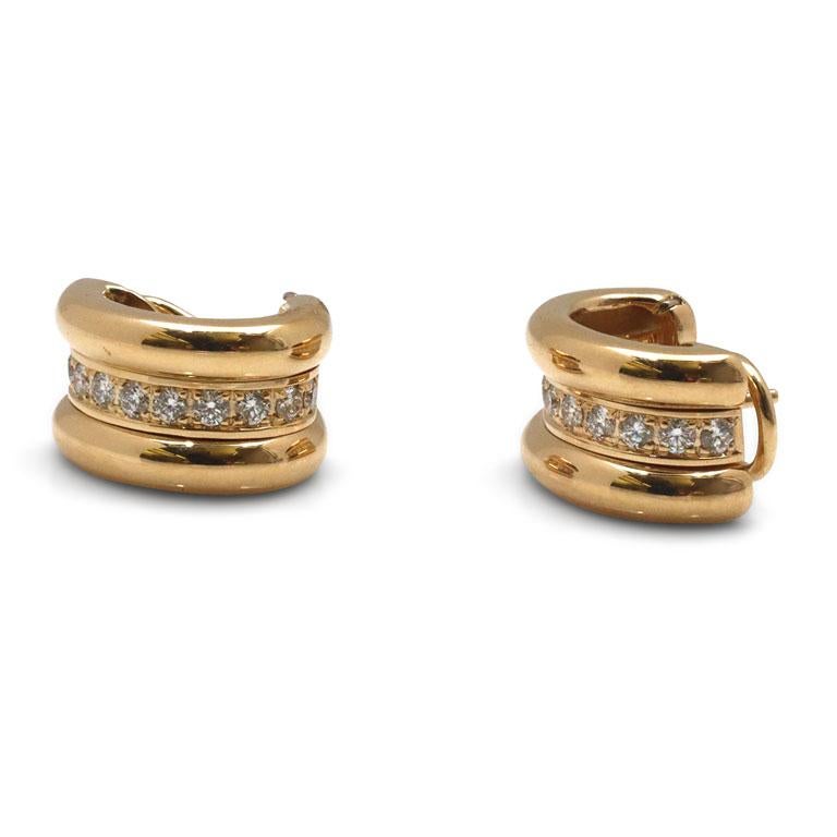 Authentic Chopard 'La Strada' earrings crafted in 18 karat Yellow Gold. These wearable huggie-style earrings are comprised of three sections, the center section set with sparkling round brilliant cut diamonds weighing an estimated 1.80 carats (F-G