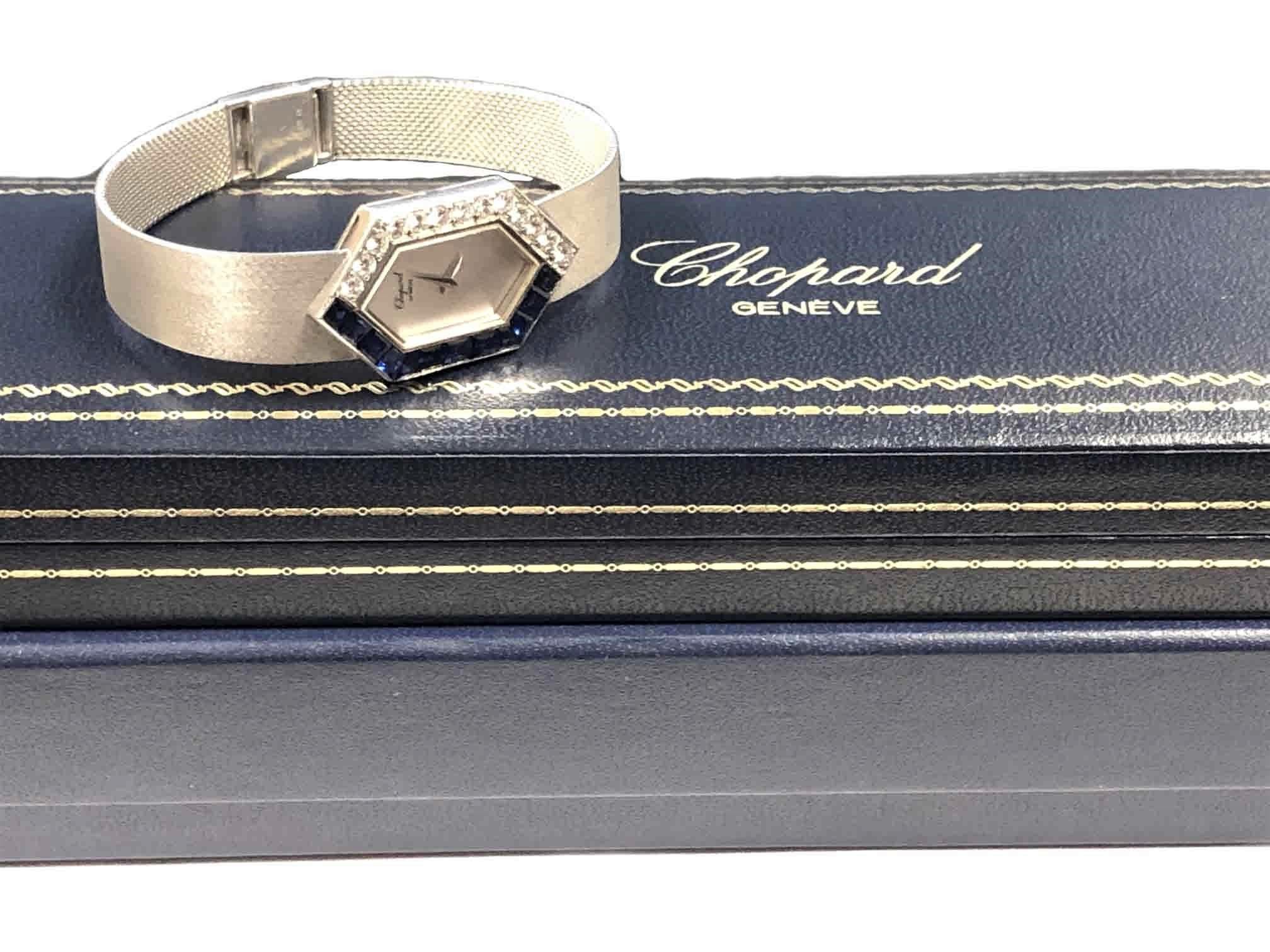 Circa 1990 Chopard Ladies Wrist Watch, 31 X 19 M.M. 2 Piece 18K White Gold case, bezel set with Round Brilliant cut Diamonds totaling 1.50 Carats and Grading as F - G in color and VS in Clarity and further set with very fine step cut Sapphires. 17