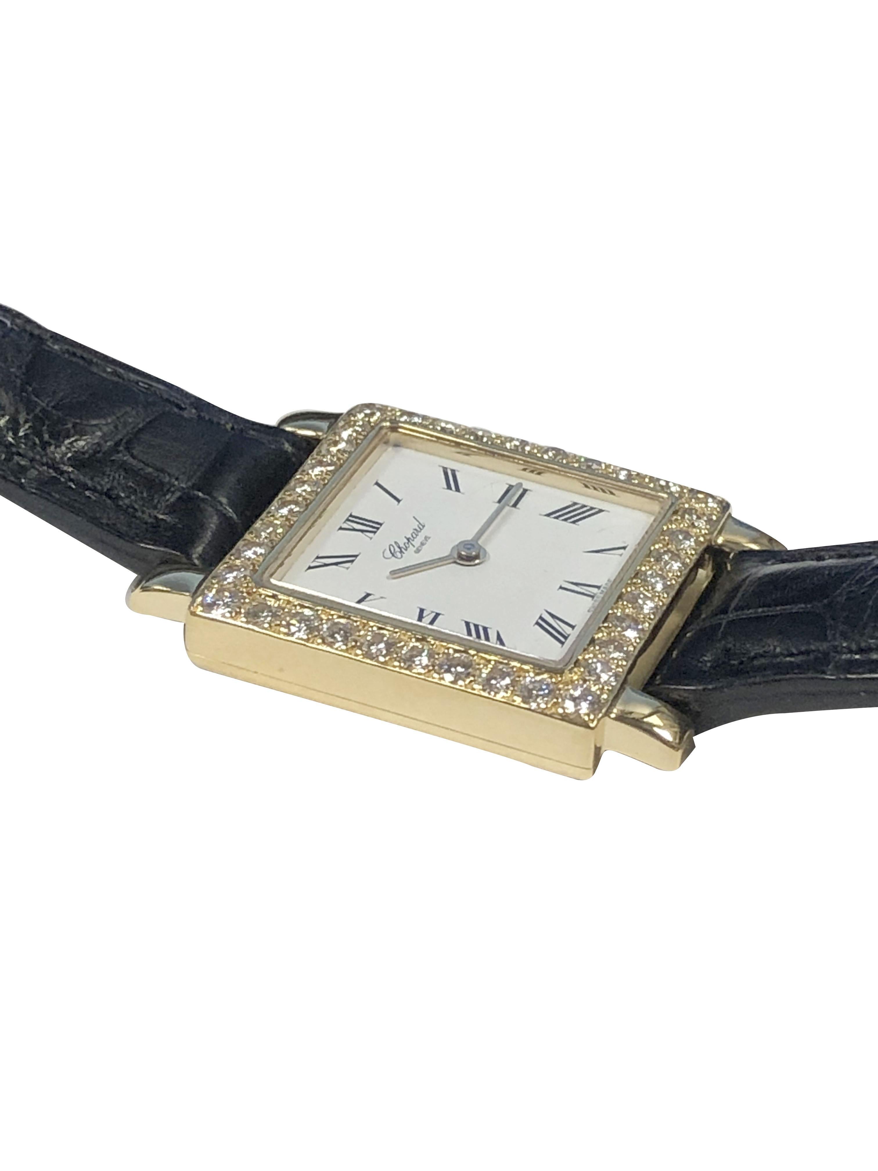 Circa 2000 Chopard Ladies Wrist Watch, 21 X 21 M.M. 18K yellow Gold 2 Piece water resistant case with Diamond set Bezel, containing Round Brilliant cut Diamonds totaling 1 Carat. Quartz Movement, White Dial with Black Roman Numerals. Black Croco