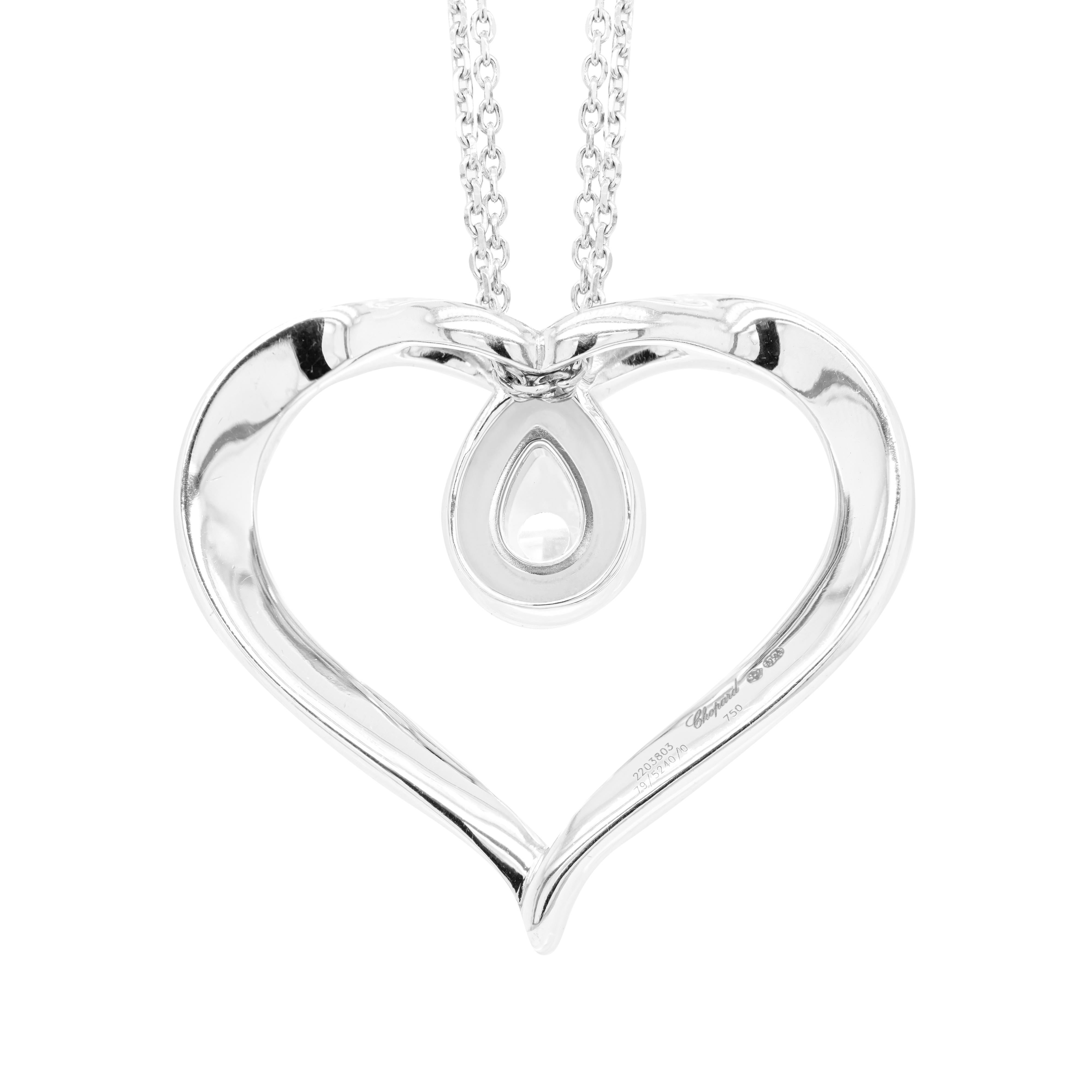 Beautiful loop heart pendant from Chopard's iconic Happy Diamonds collection inlaid with 48 fine round brilliant cut diamonds, weighing a total approximate weight of 2.00 carats. Chopard's signature mobile 'Happy Diamond' is beautifully encased