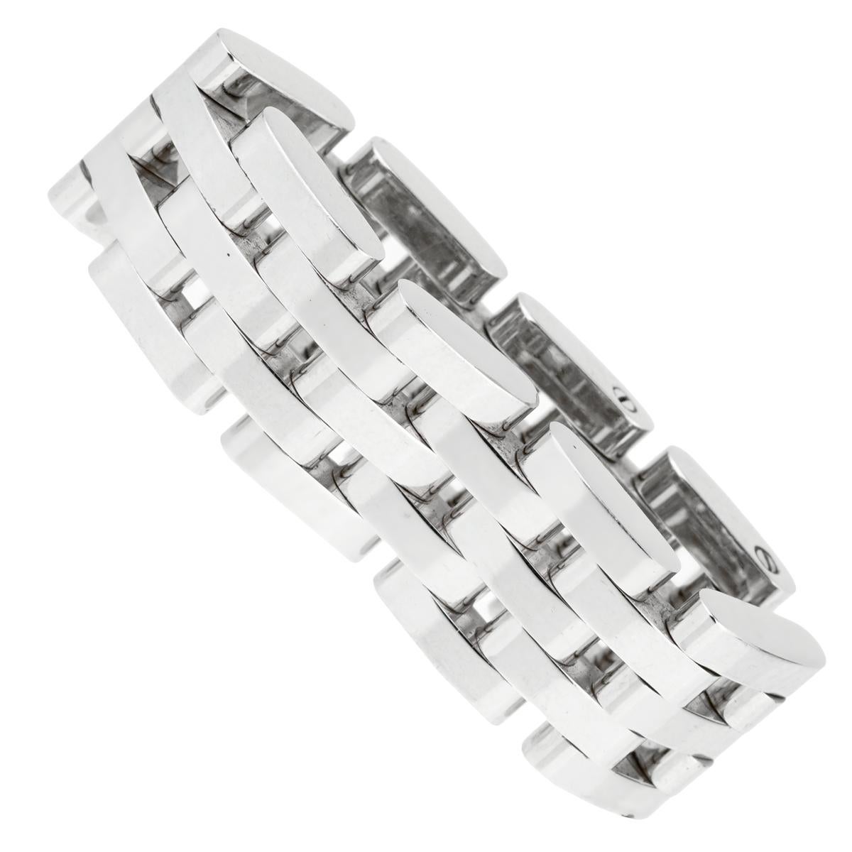 A fabulous Chopard Les Chaines ring showcasing 5 flexible rows of 18k white gold. This classic design is perfect for everyday wear.

Width: .37