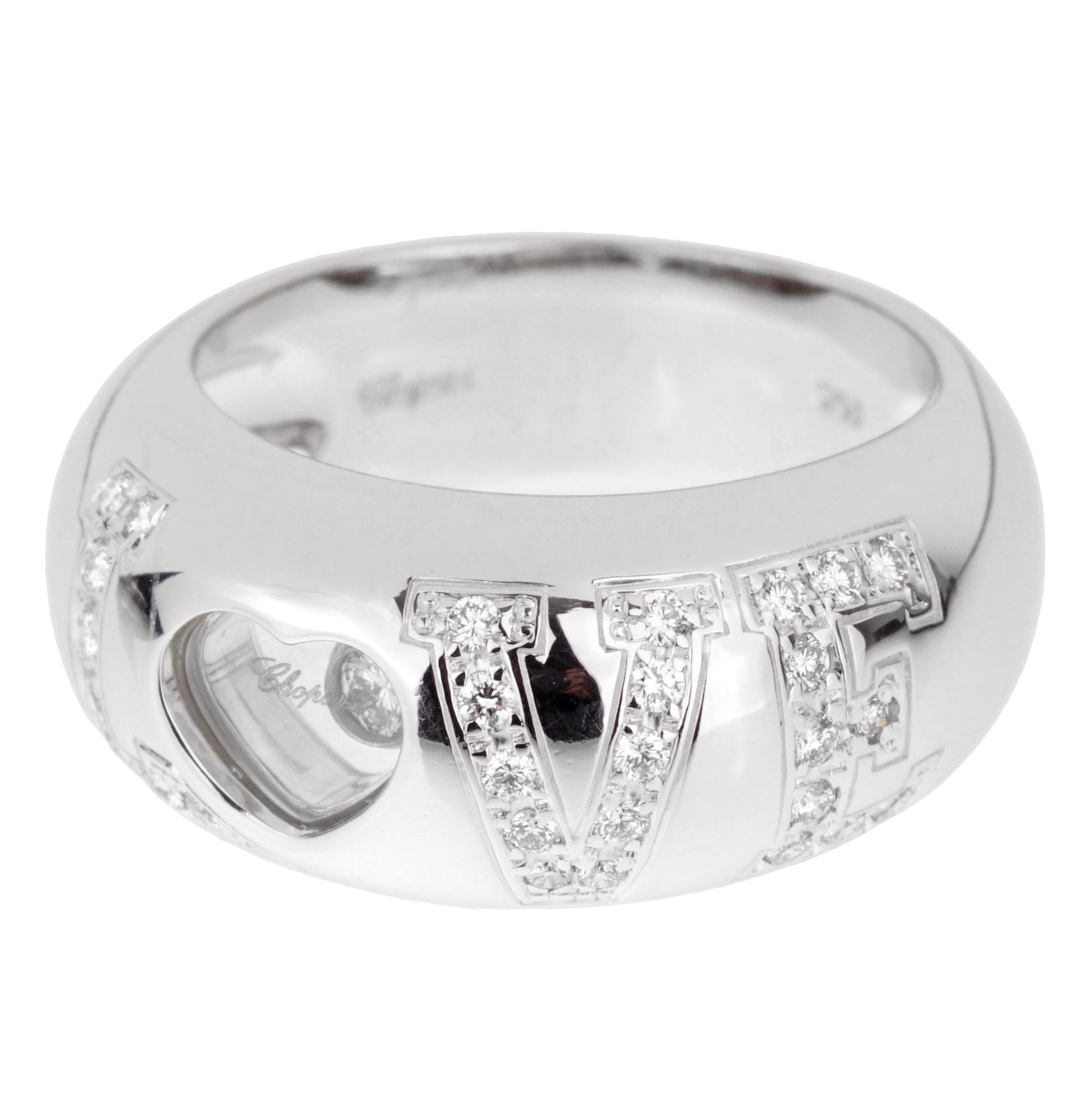 A fabulous Chopard happy diamond ring adorned with round brilliant cut diamonds in shimmering 18k white gold. The ring measures a size 4 1/2 and can be resized.
