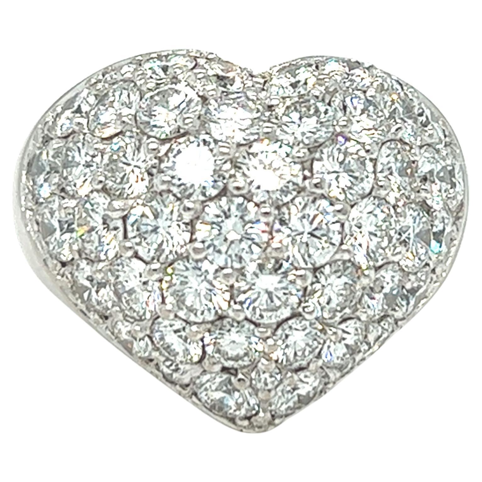 This rare-find classic LOVE heart shaped ring by Chopard features approximately 6 carats of colorless diamond. Round brilliant cut diamonds are pavé set into a beautiful dome heart. The LOVE is spelled out and engraved inside the ring. The ring is