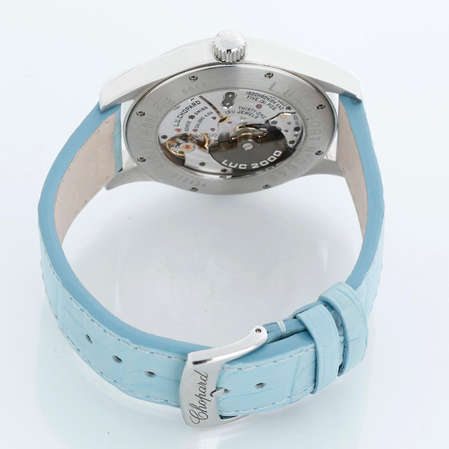 Chopard LUC  Sport Stainless Steel Ladies Watch - Automatic. Stainless Steel with factory diamond bezel and diamond lugs ( 40 mm ). White dial stick hour markers. Chopard Blue strap with Chopard Stainless steel tang buckle. Pre-owned with Chopard
