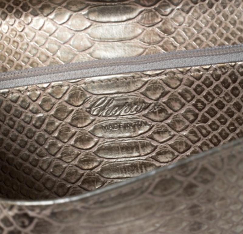This wallet from Chopard is one creation a fashionista like you must own. It has been wonderfully crafted from python-embossed leather and it flaunts a classy gold shade. It also comes equipped with a plaque-adorned flap that opens to reveal an