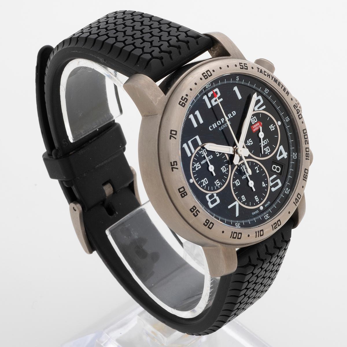 Our very rare Chopard Mille Miglia chronograph with date , reference 8915, features a titanium 40mm case with sapphire glass caseback and rubber Dunlop tyre strap with tang buckle. This particular example is a competitors watch, given or eligible to