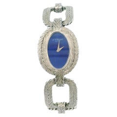 chopard oval lapis dial cush shp herringbone link brac 18kw