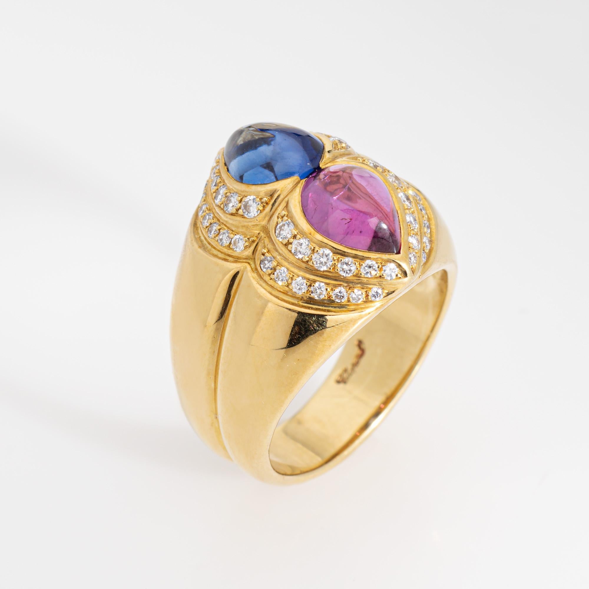 Estate Chopard pink & blue sapphire ring crafted in 18 karat yellow gold.  

Cabochon cut pink and blue sapphires measure 7.5mm x 5.5mm. Diamonds total an estimated 0.25 carats (estimated at G-H color and VS2-SI1 clarity). The sapphires are in very