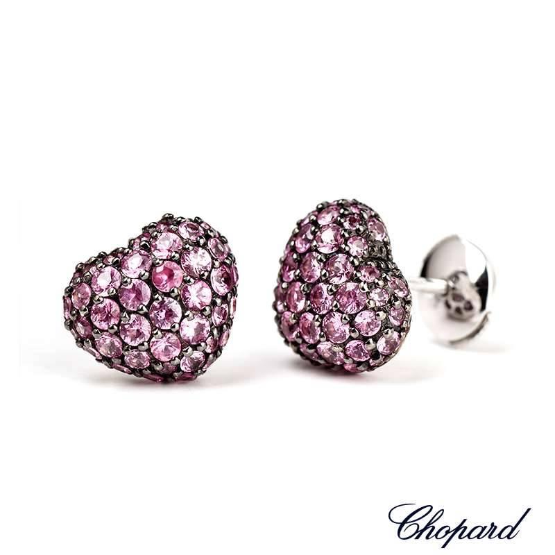 A pair of Chopard 18k White Gold pink sapphire heart shape studs. Set with 86 pink Sapphires totalling 2.47ct. The earrings are approximately 1cm x 1cm. Chopard Model No. 83/4203-1010

The earrings come complete with box and original Chopard papers,