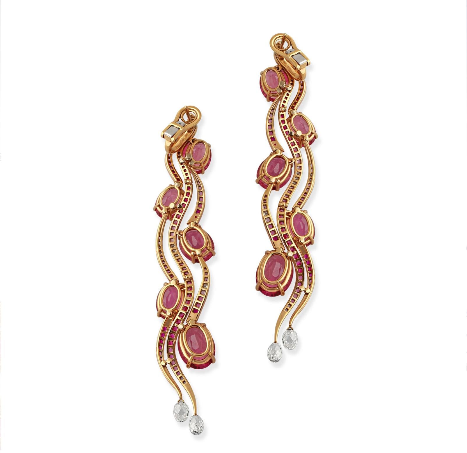 A pair of 18k yellow gold pink tourmaline and diamond earrings by Chopard. A beautifully designed statement piece created by Chopard for the Red Carpet collection that launches each year alongside the Cannes Film Festival. These earrings are set