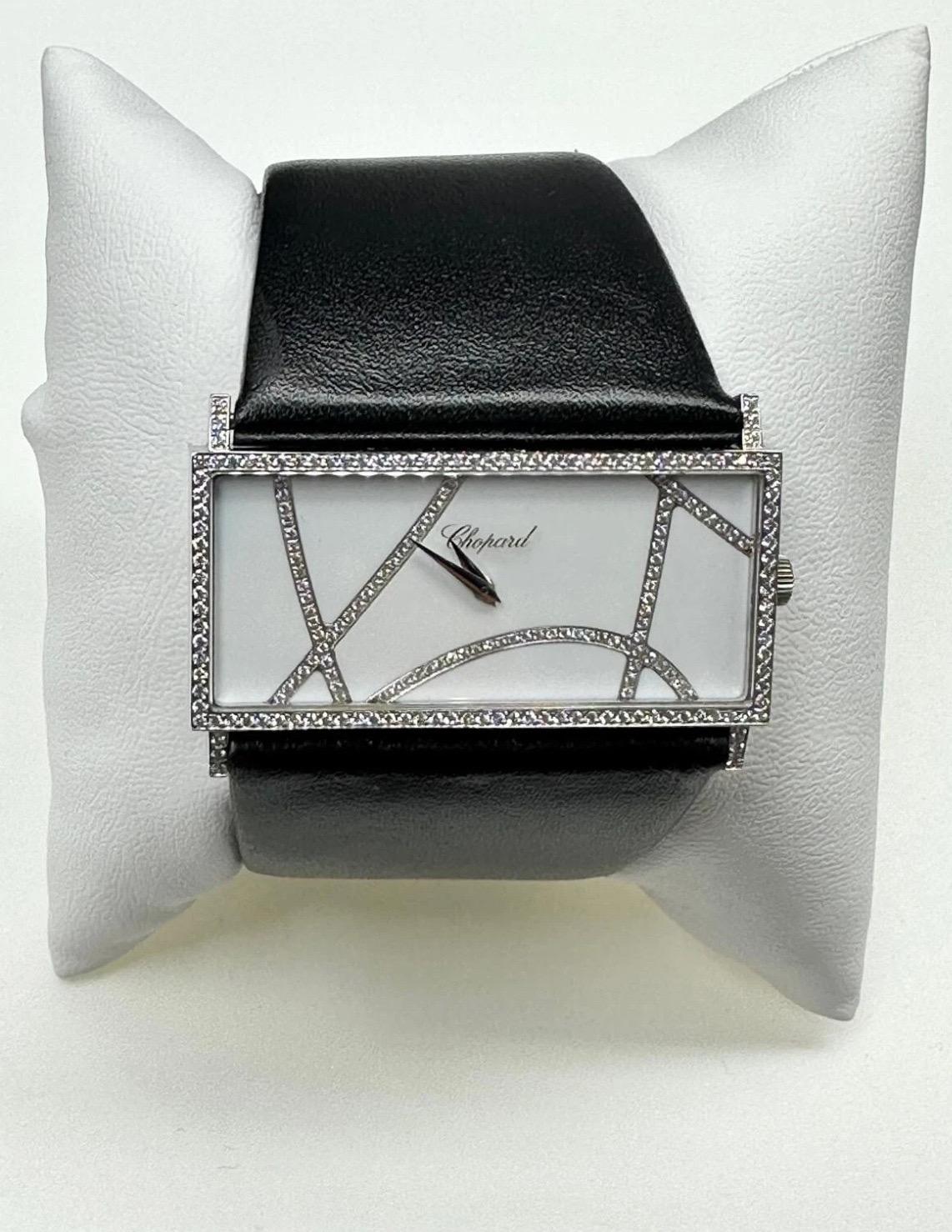 Excellent condition beautiful Chopard Rectangle reference 13/9130 18k White Gold ladies wristwatch. 
White dial, special diamond pattern dispersed across the dial, an 18k White Gold 43mm case, diamond bezel, diamond shoulders, winder and diamond