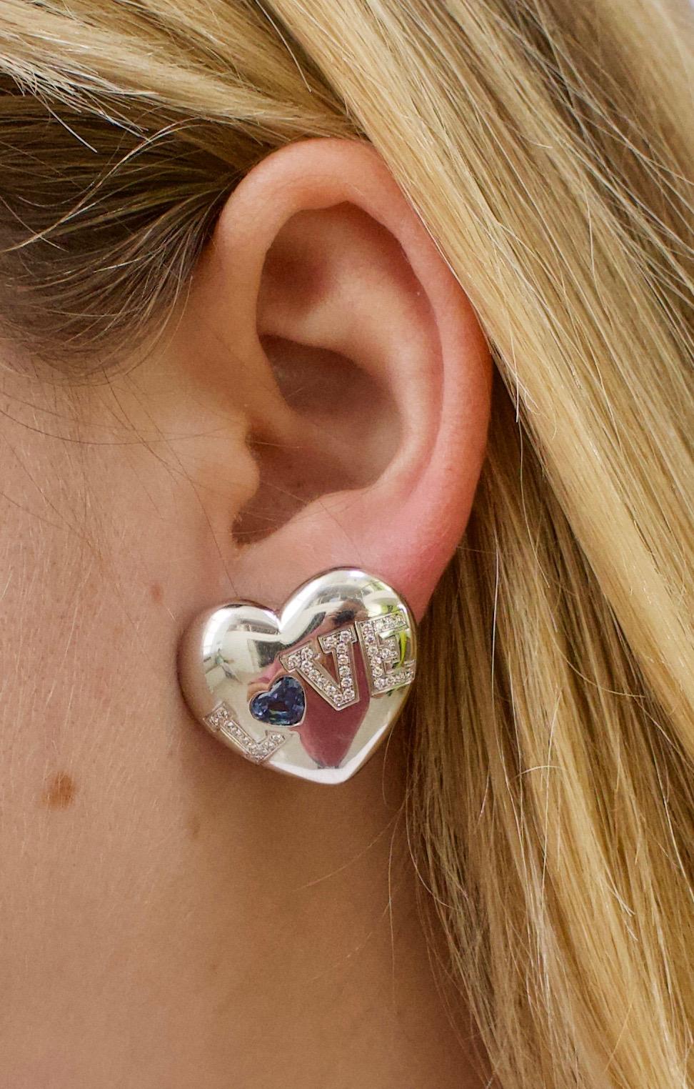 Chopard Sapphire and Diamond Puff Heart Earrings in 18k Gold, Circa 2005

Timeless elegance meets refined craftsmanship in these exquisite Chopard Puff Heart earrings, crafted in rich 18k yellow gold, circa 2005.

At the heart of each earring lies a