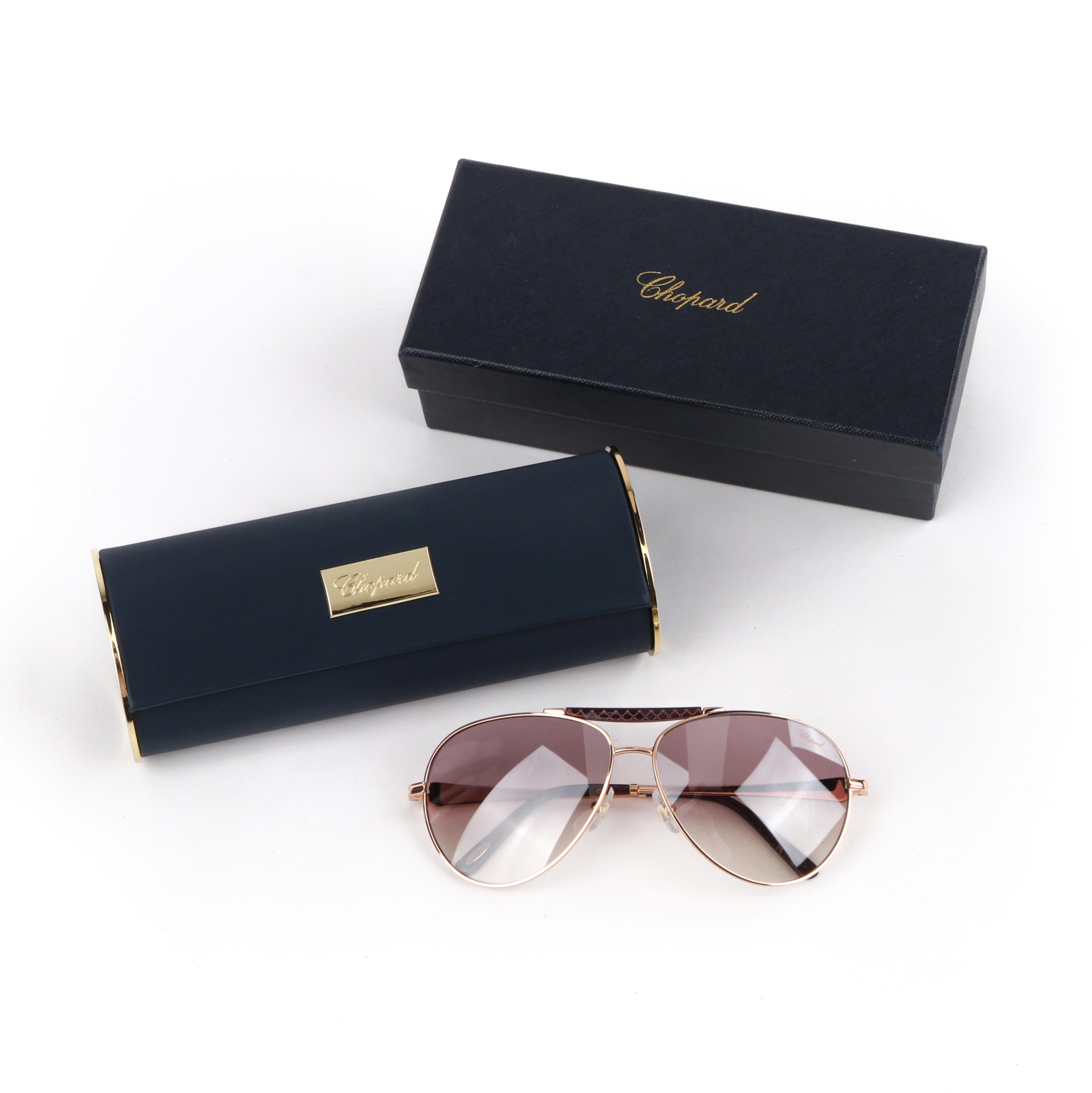 CHOPARD SCH 870S Rose Gold Plum Titanium Frame Aviator Sunglasses with Amethyst 

Brand / Manufacturer: Chopard
Manufacturer Style Name: SCH 870S
Style: Aviator Sunglasses 
Color(s): Colorway “8FCX,” rose gold, plum; plum gradient lenses
Lined: