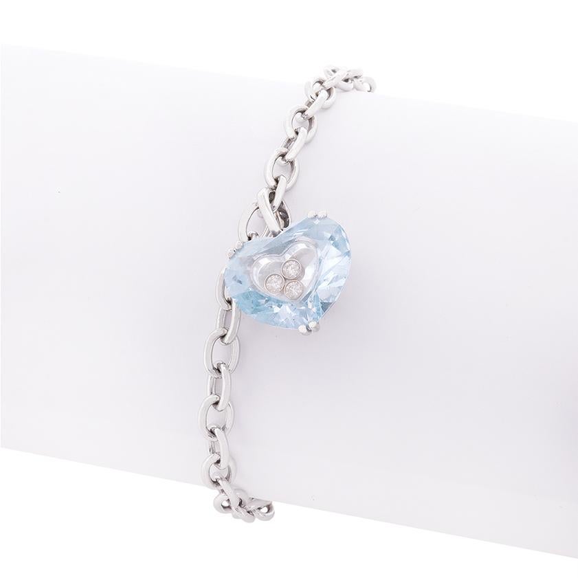 From the hugely popular 'So Happy Heart' collection by Chopard, this bracelet features a collection of little round brilliant diamonds set within a heart shaped aquamarine stone. The diamonds have a combined weight of 0.17 carat and are F in colour,