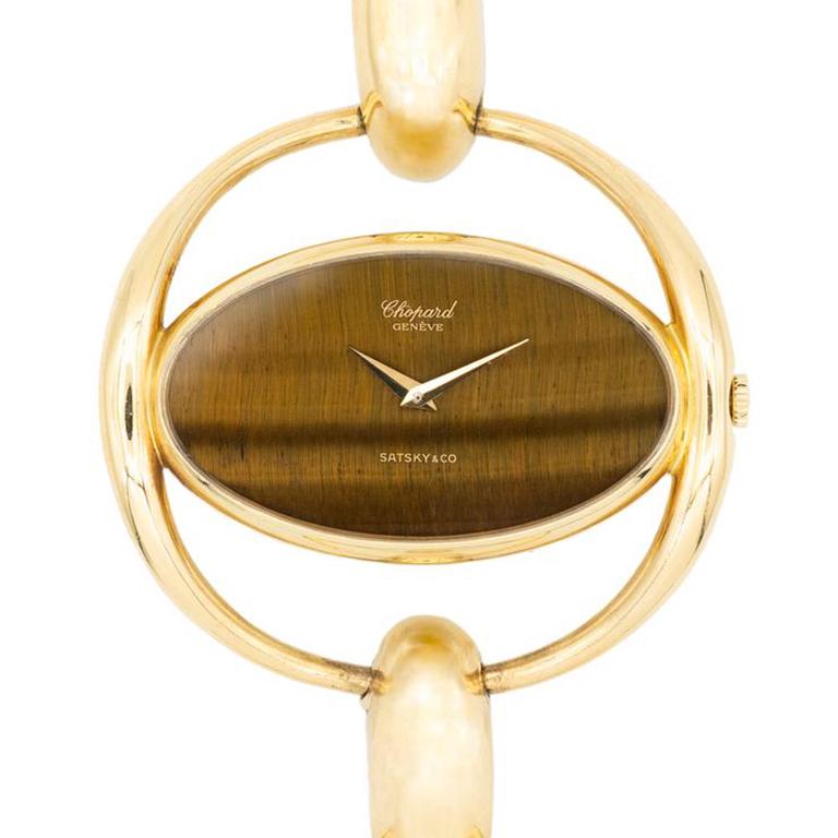 Vintage Chopard Tigers Eye 18 Karat Yellow Gold Watch 50391 
circa 1970s
w/ Chopard Service Papers 2020

When Louis-Ulysse Chopard established his brand in 1860 in Sonvilier, Switzerland, he wascompeting against eighty other watchmakers in a town