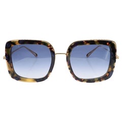 Chopard Gafas de sol de titanio con montura de oro rosa brillante y lentes azules degradadas 95221-0452