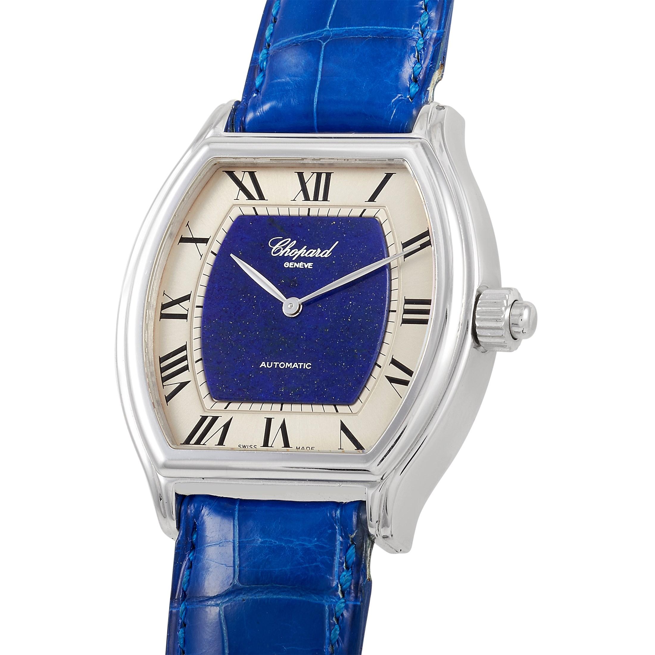 This Chopard Tonneau-shaped Concealed Erotic Watch, reference number 16/2254/478 is a unique and rare piece. The case is presented in 18K white gold, and measures 43mm in diameter, and comes on a blue leather strap. The case back features an