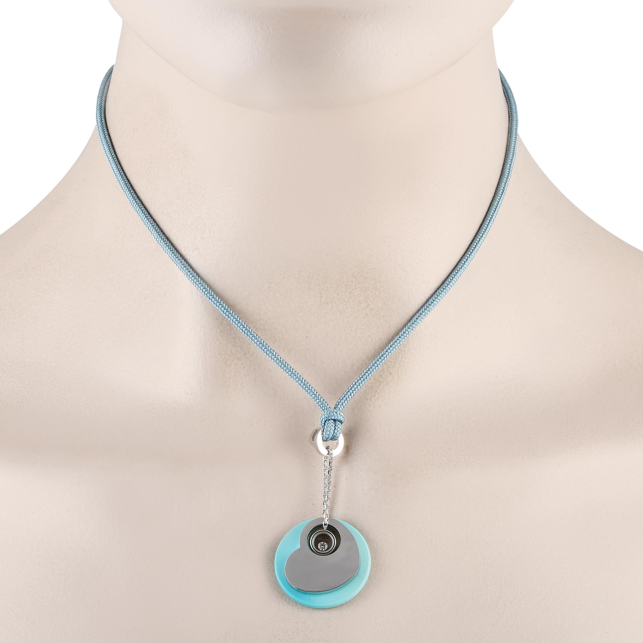 This captivating Chopard Turquoise necklace is a statement-making piece that will continually capture your imagination. Suspended from a 15 blue cord, youll find a bright blue pendant measuring 1 round that is elevated by an 18K White Gold heart