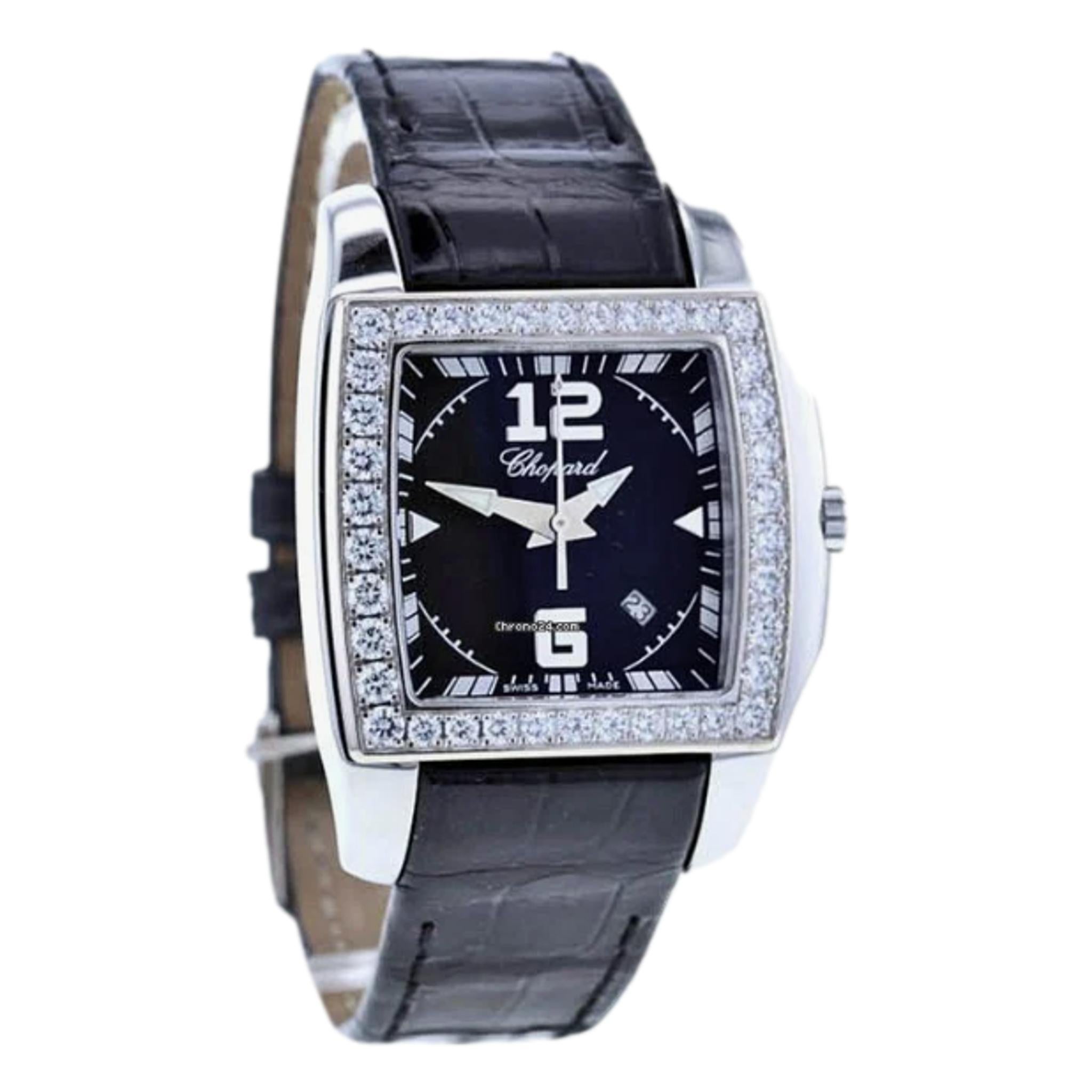 Chopard Two O Ten Diamond & Stainless Steel Watch With Crocodile Skin Strap

Square-shaped, diamond encrusted bezel with black face and 'Chopard' signature to the centre.

Detailed 38 brilliant cut white diamonds. 

Silver arrow-shaped hands, index