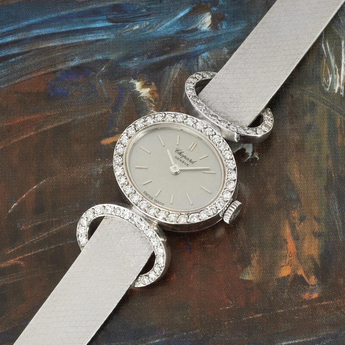 A white gold vintage Cocktail Watch from Chopard. Featuring a silvered dial complemented by the bezel which is set with 32 round brilliant cut diamonds. The piece is fitted with mineral glass and a manual wind movement.

The integrated woven white