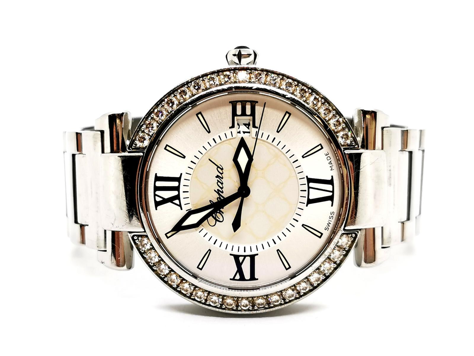 Shows signed Chopard. Imperial model. stainless steel. bezel 37 brilliant cut diamonds. for a total of about 1.17 carats. size 36 mm housing. quartz movement. clasp. silver dial with center pearl. set on the crown of about 0.06 ct amethyst. wrist
