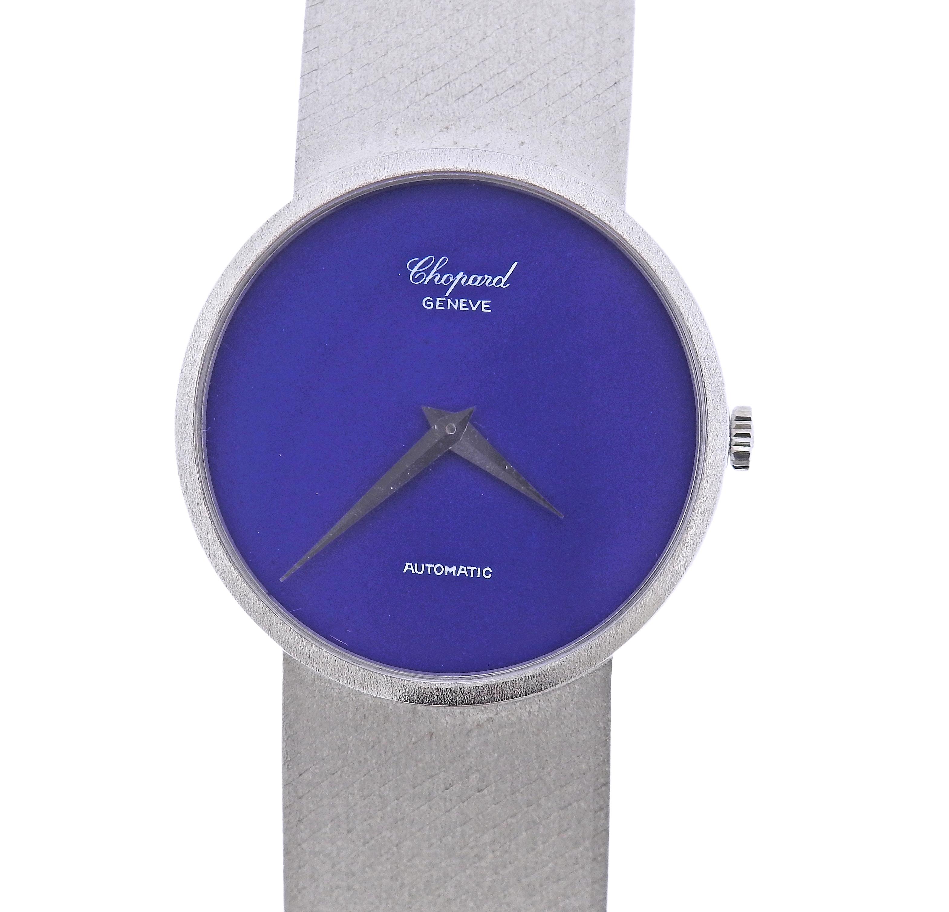 Classic 18k white gold watch by Chopard, with blue dial. Watch case is 33mm in diameter. Bracelet is 6.5